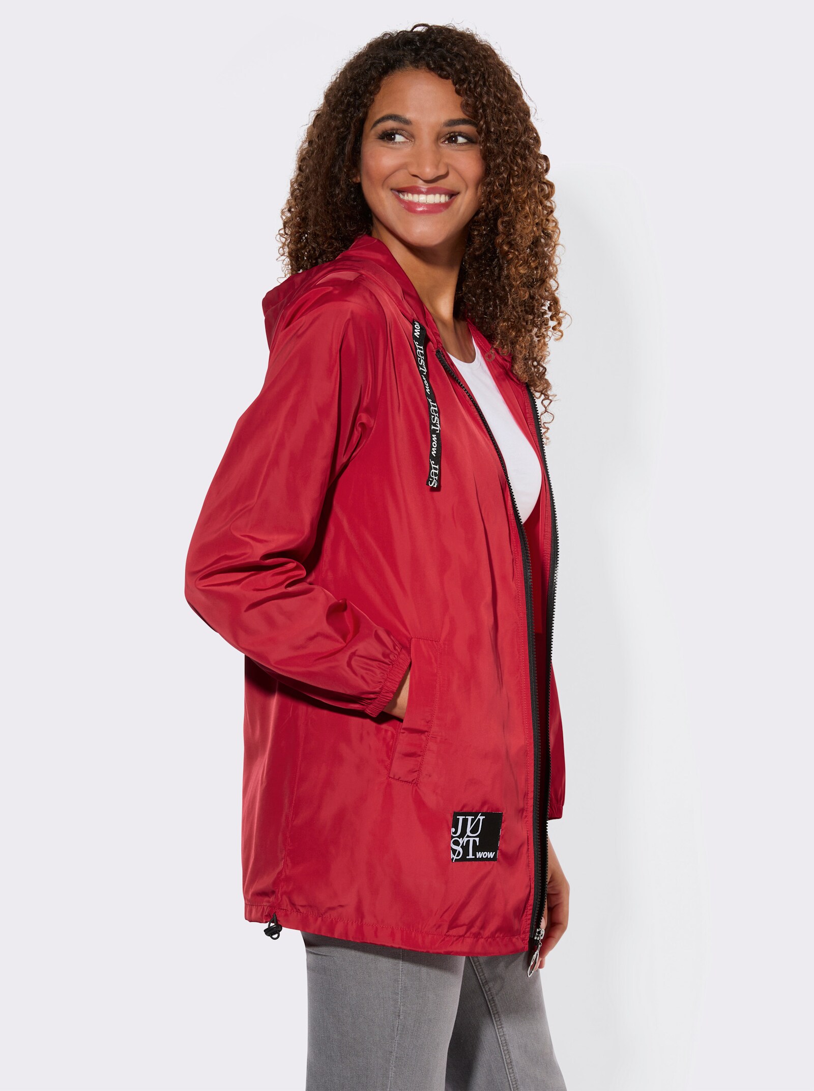 Kapuzenjacke mit Schriftzug im Comic-Stil - rot