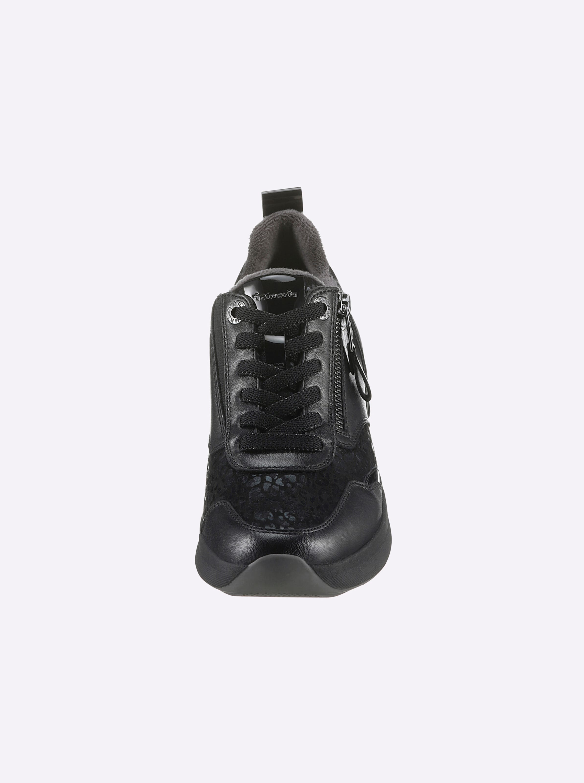 Leder/Vinyl günstig Kaufen-Sneaker in schwarz von Tamaris. Sneaker in schwarz von Tamaris <![CDATA[Kräftige Füße brauchen viel Platz. Und den bietet der Sneaker von Tamaris in Komfort-Weite. Obermaterial aus Glattleder und Lederimitat. Innenausstattung aus Textil und Leder. Mit 