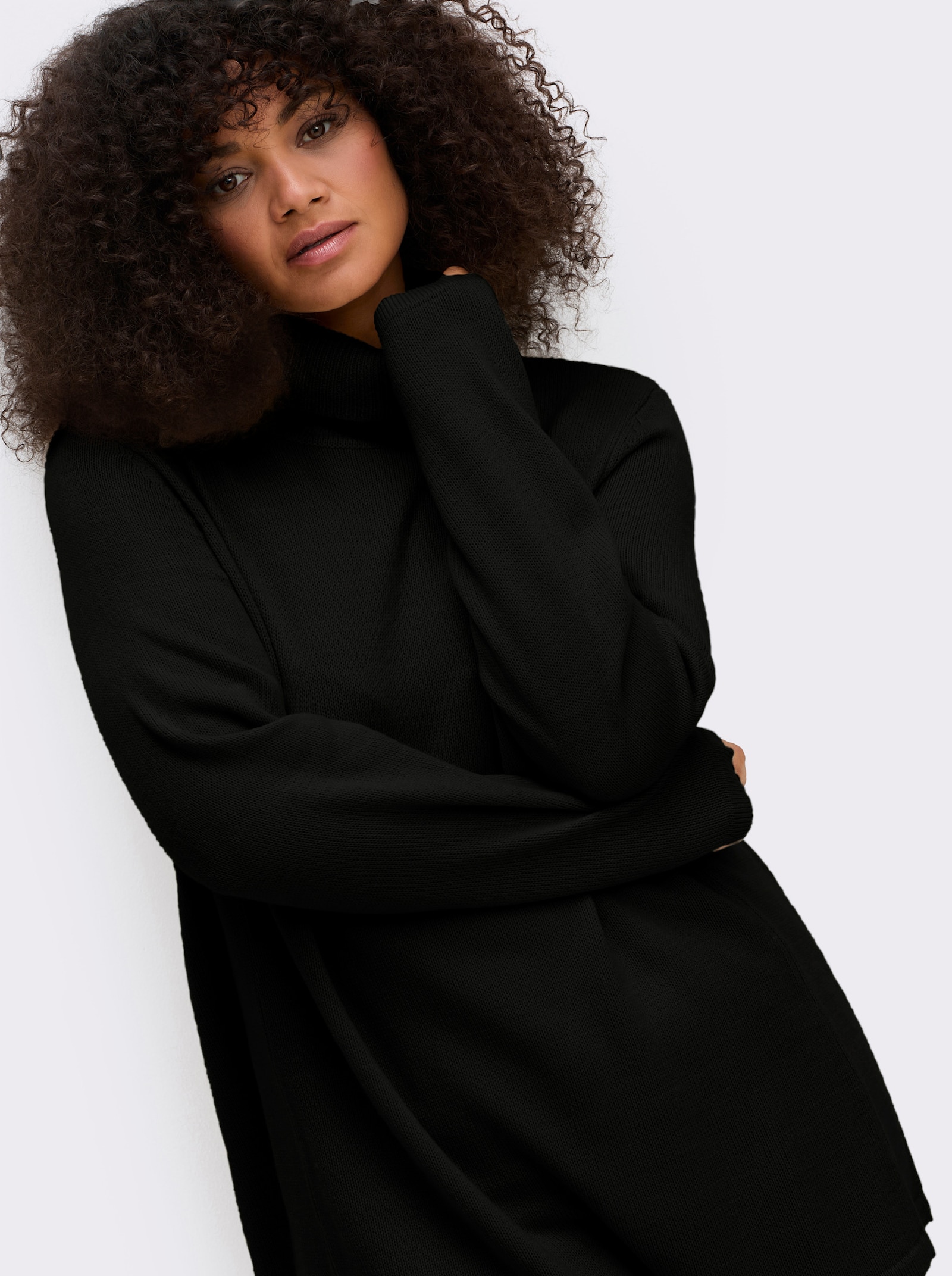 sheego Rollkragenpullover in A-Linie - schwarz