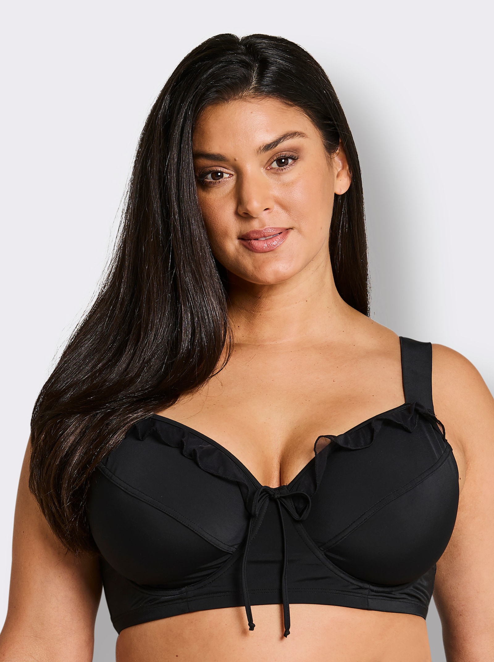 sheego Bikini-Oberteil mit Mesh-Volants und Zierschleife - schwarz