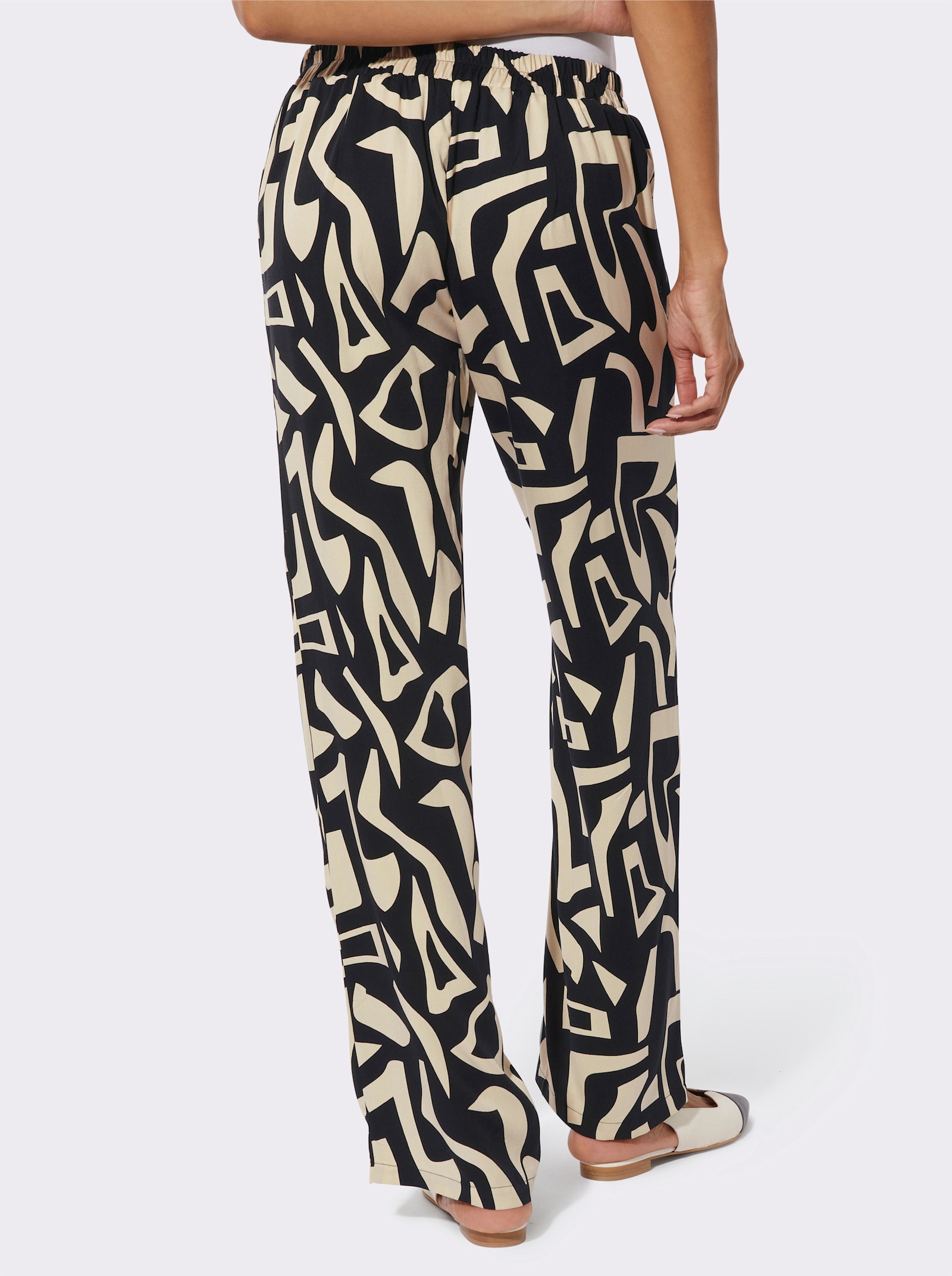 Schlupfhose mit seitlichen Taschen - sand-schwarz-bedruckt