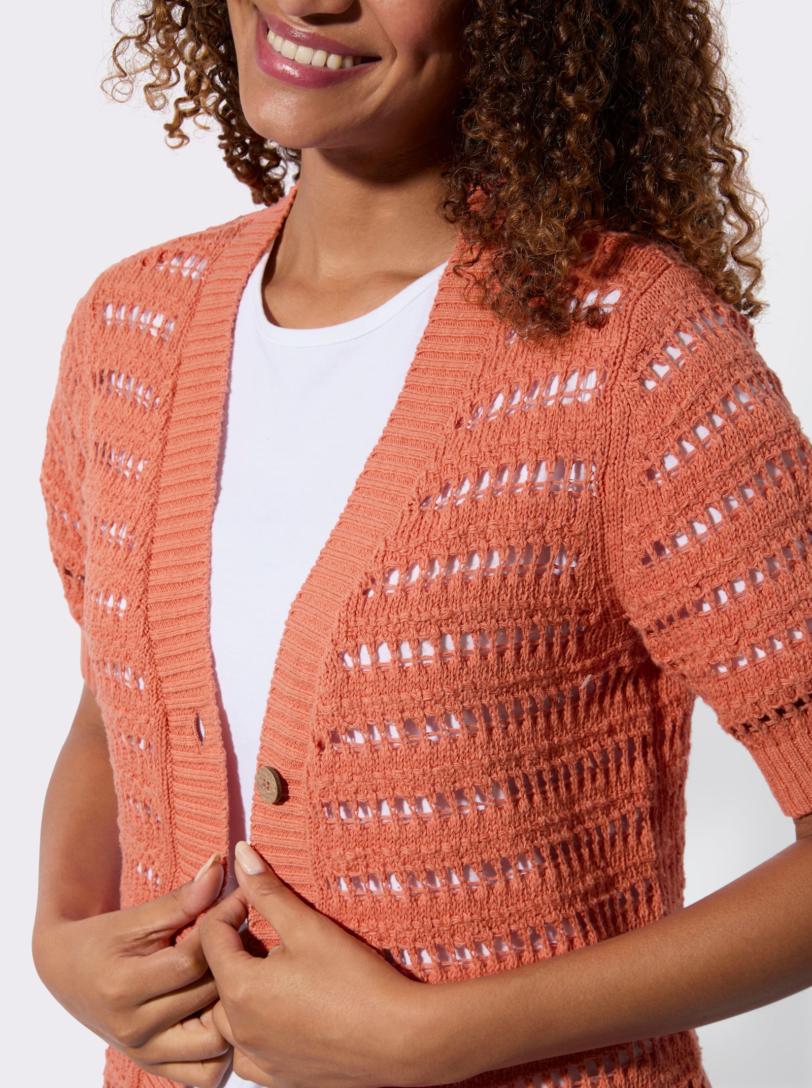Ajourstrickjacke mit Bouclé Struktur - papaya