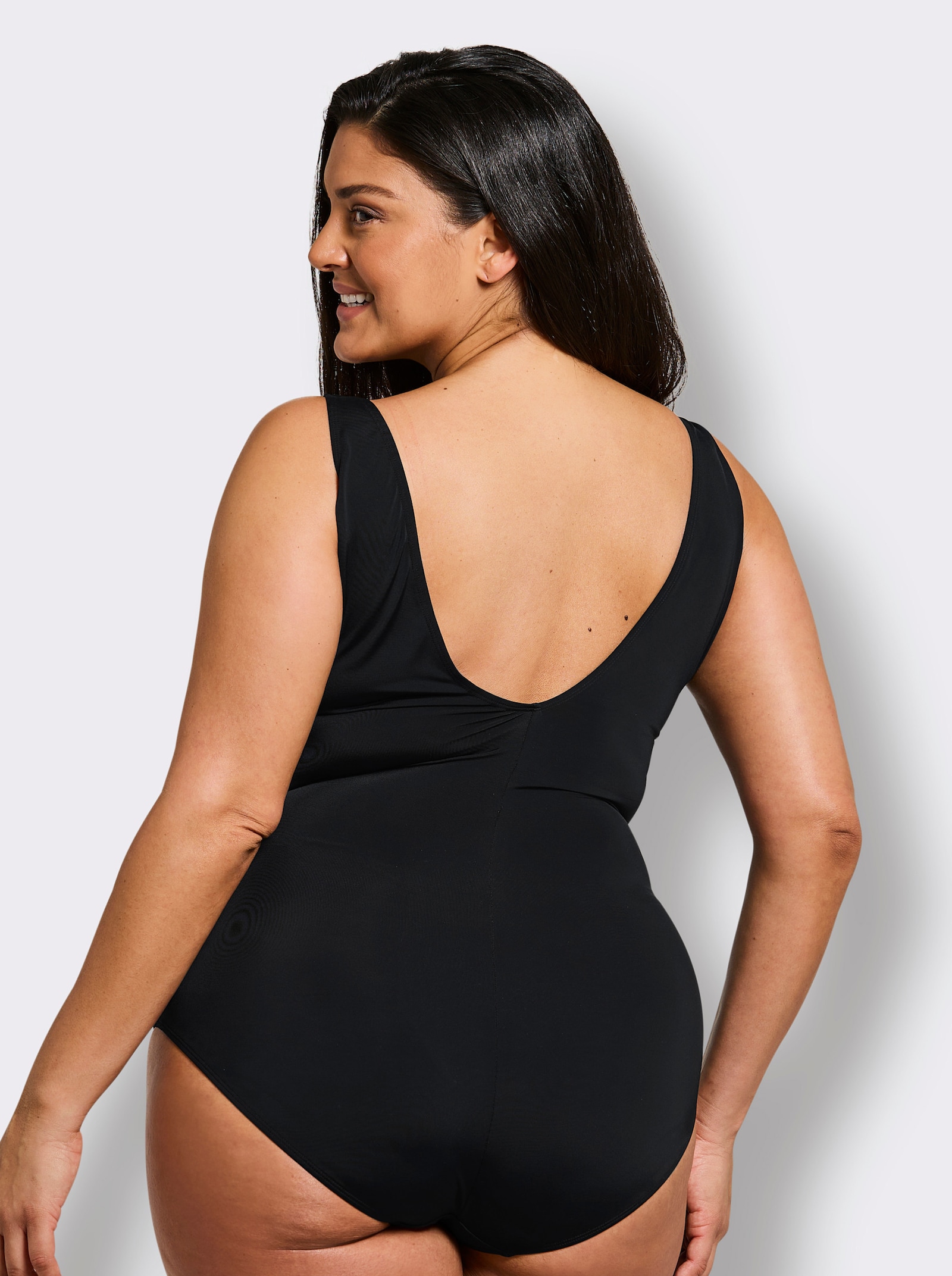 sheego Badeanzug in Wickeloptik, mit Pünktchenprint - schwarz-weiß-bedruckt