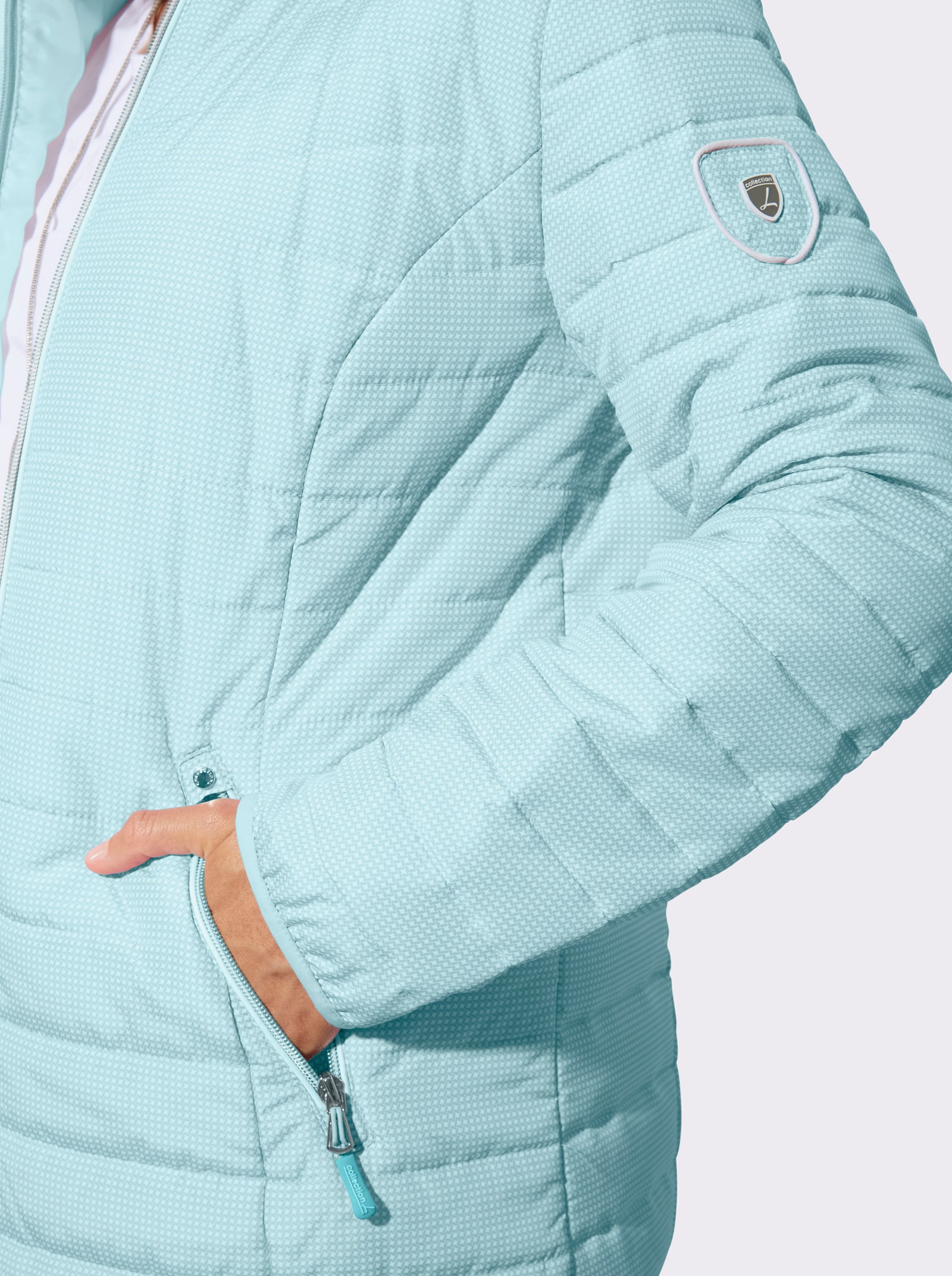 Gewatteerde jas met afneembare capuchon - mint/wit bedrukt