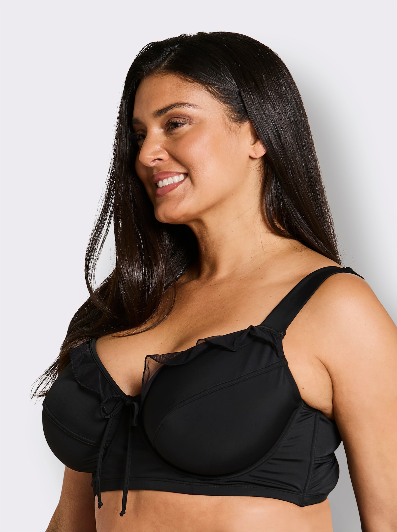 sheego Bikini-Oberteil mit Mesh-Volants und Zierschleife - schwarz