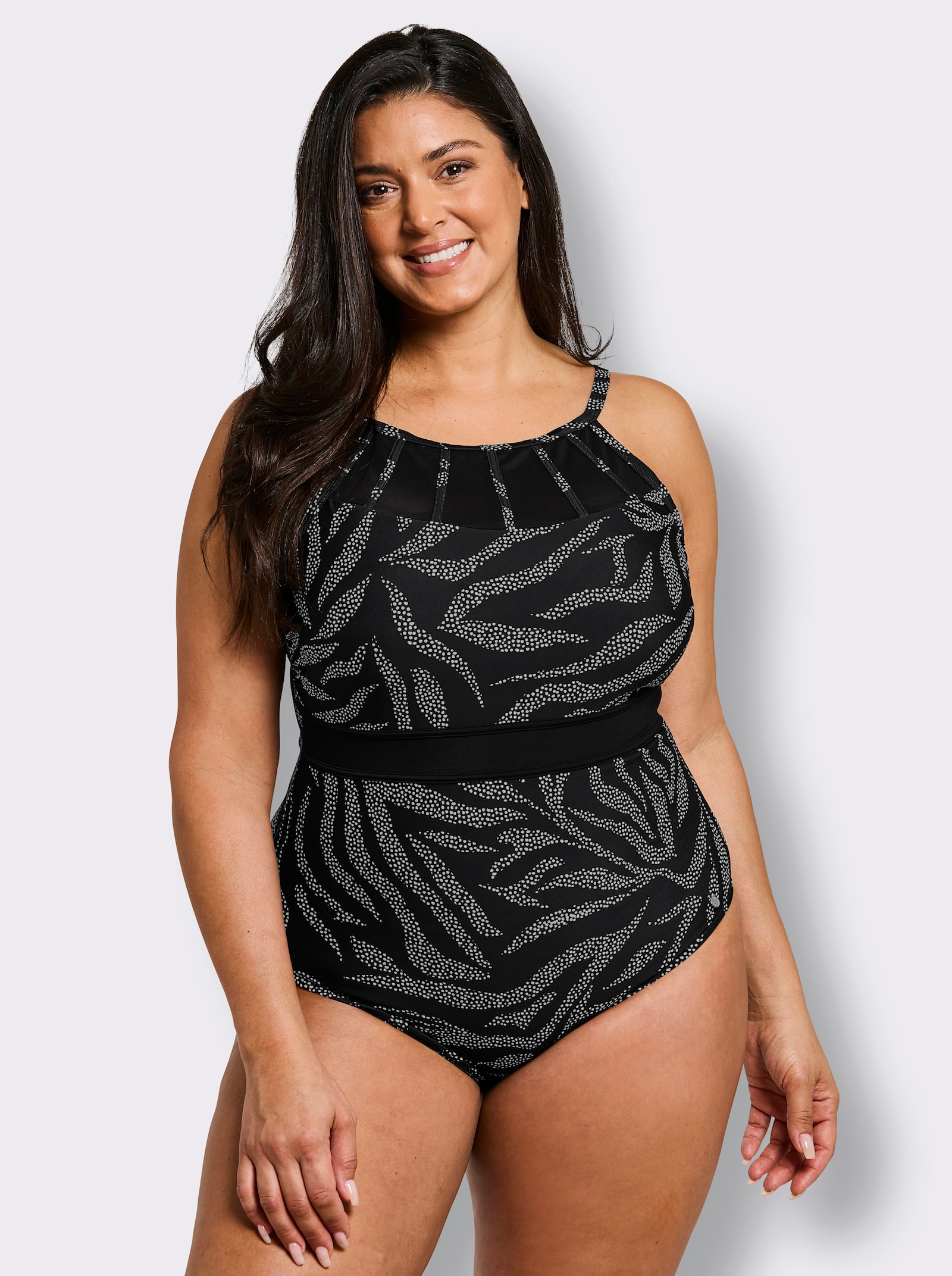 sheego Badeanzug mit Mesh-Einsatz und Shaping-Effekt - schwarz-weiß-bedruckt
