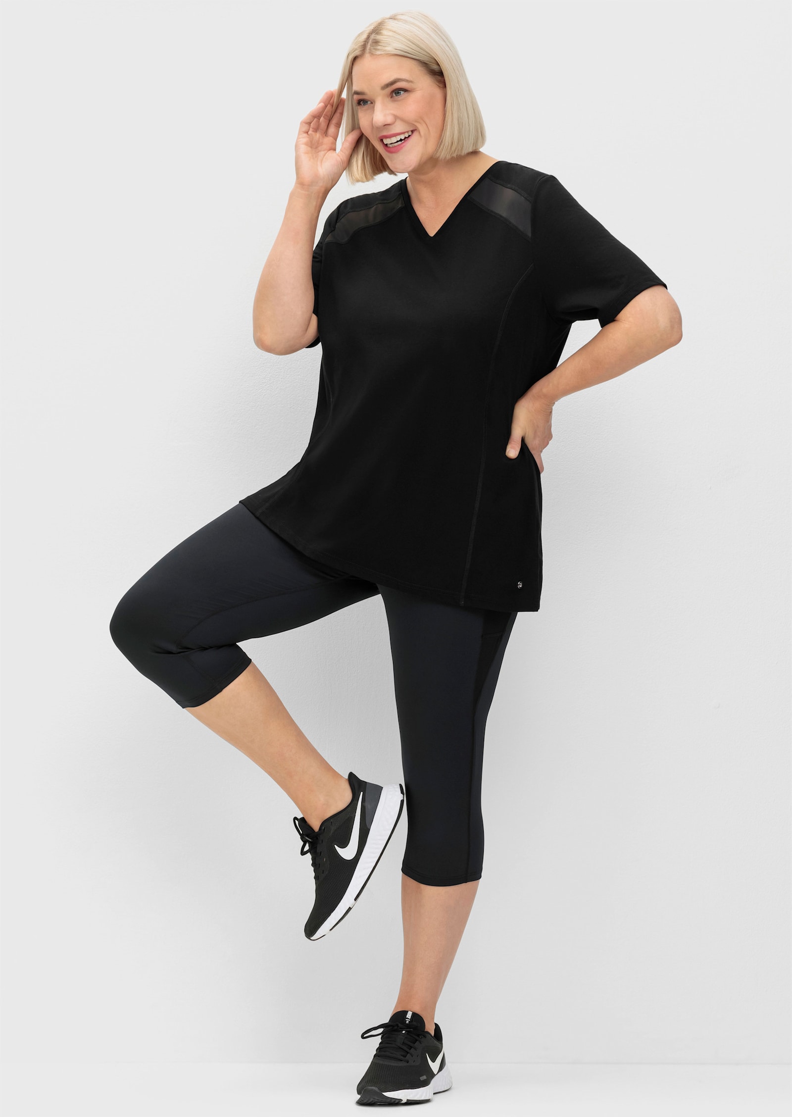 sheego Funktionsshirt mit Mesh-Details - schwarz