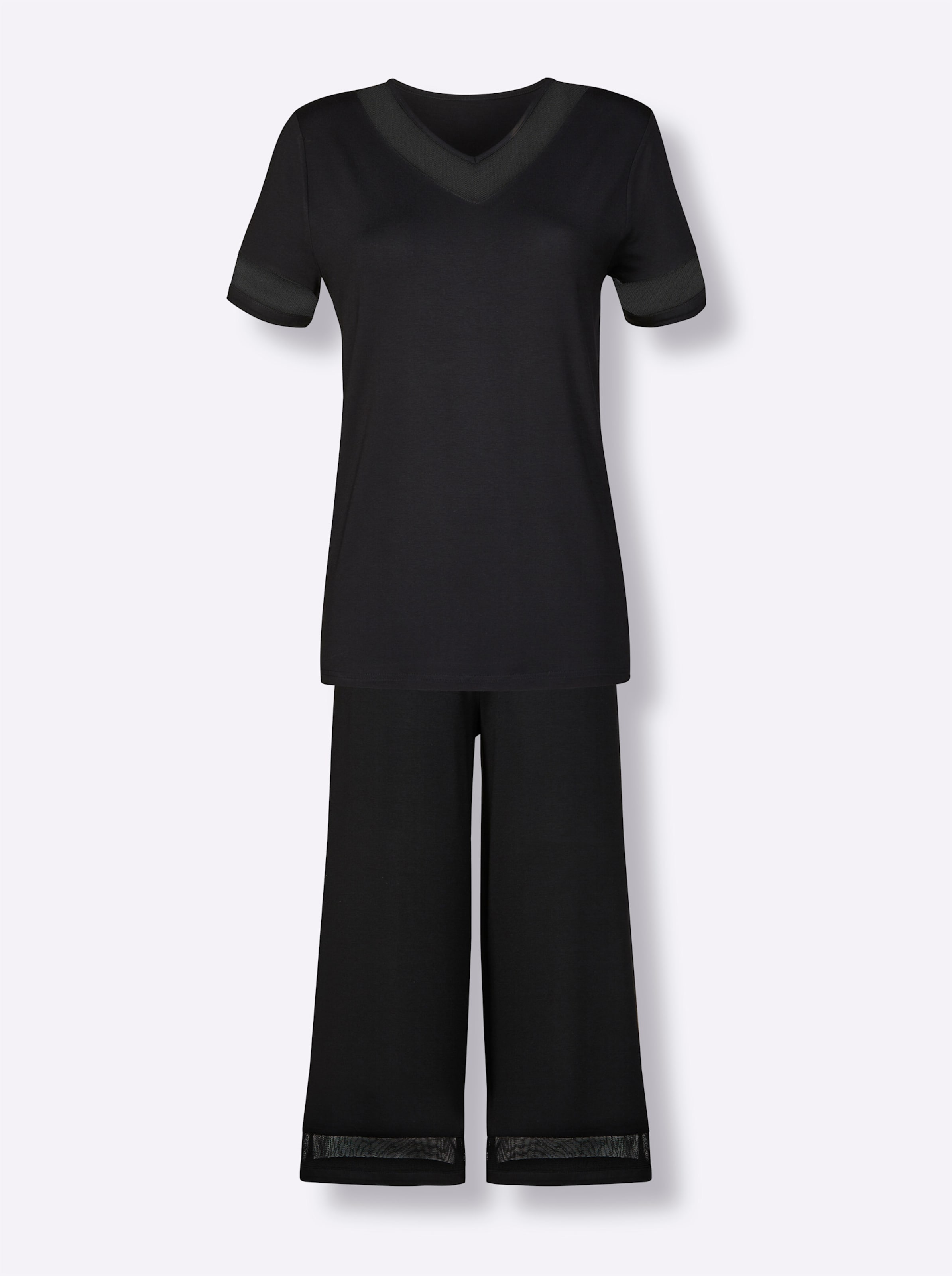Hose  günstig Kaufen-Schlafanzug in schwarz von wäschepur. Schlafanzug in schwarz von wäschepur <![CDATA[Attraktiver Schlafanzug mit leicht transparenten Mesh-Einsätzen am V-Ausschnitt und an den Beinabschlüssen. Die modische 7/8-Hose ist mit einem komfortablem De