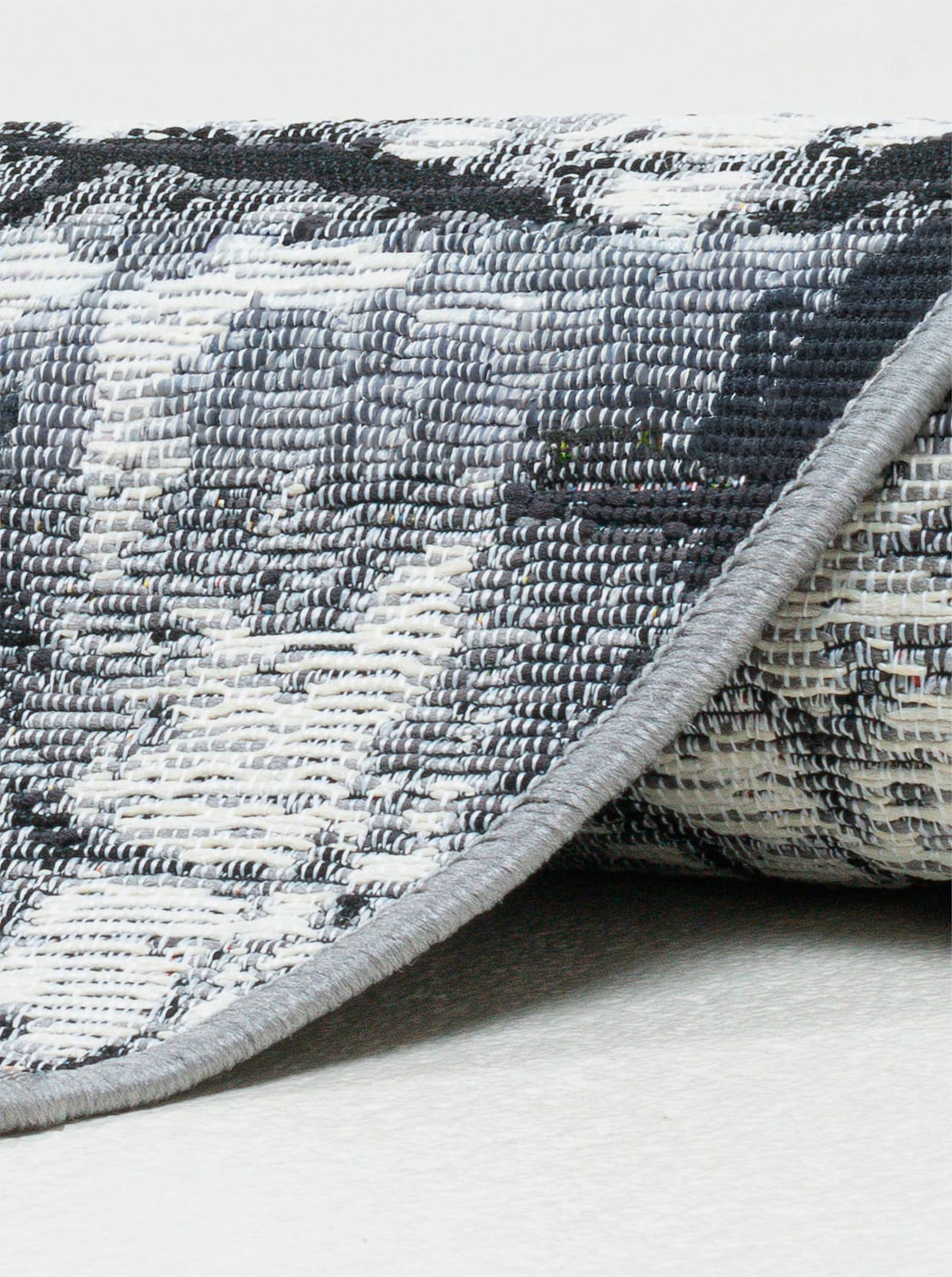 Theko Teppich - grau-gemustert