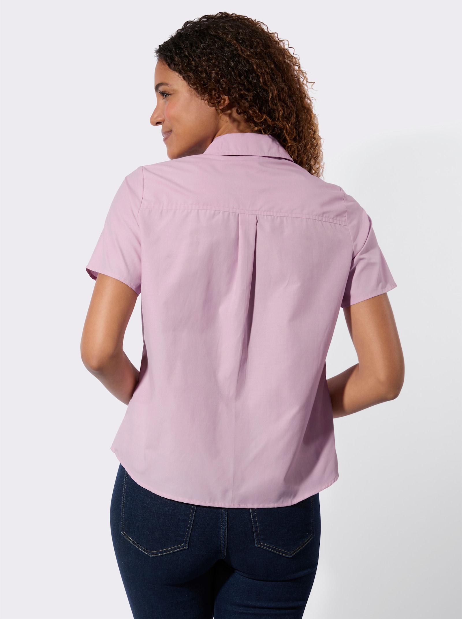 Blouse met korte mouwen en stolpplooi die voor wijdte zorgt - roze