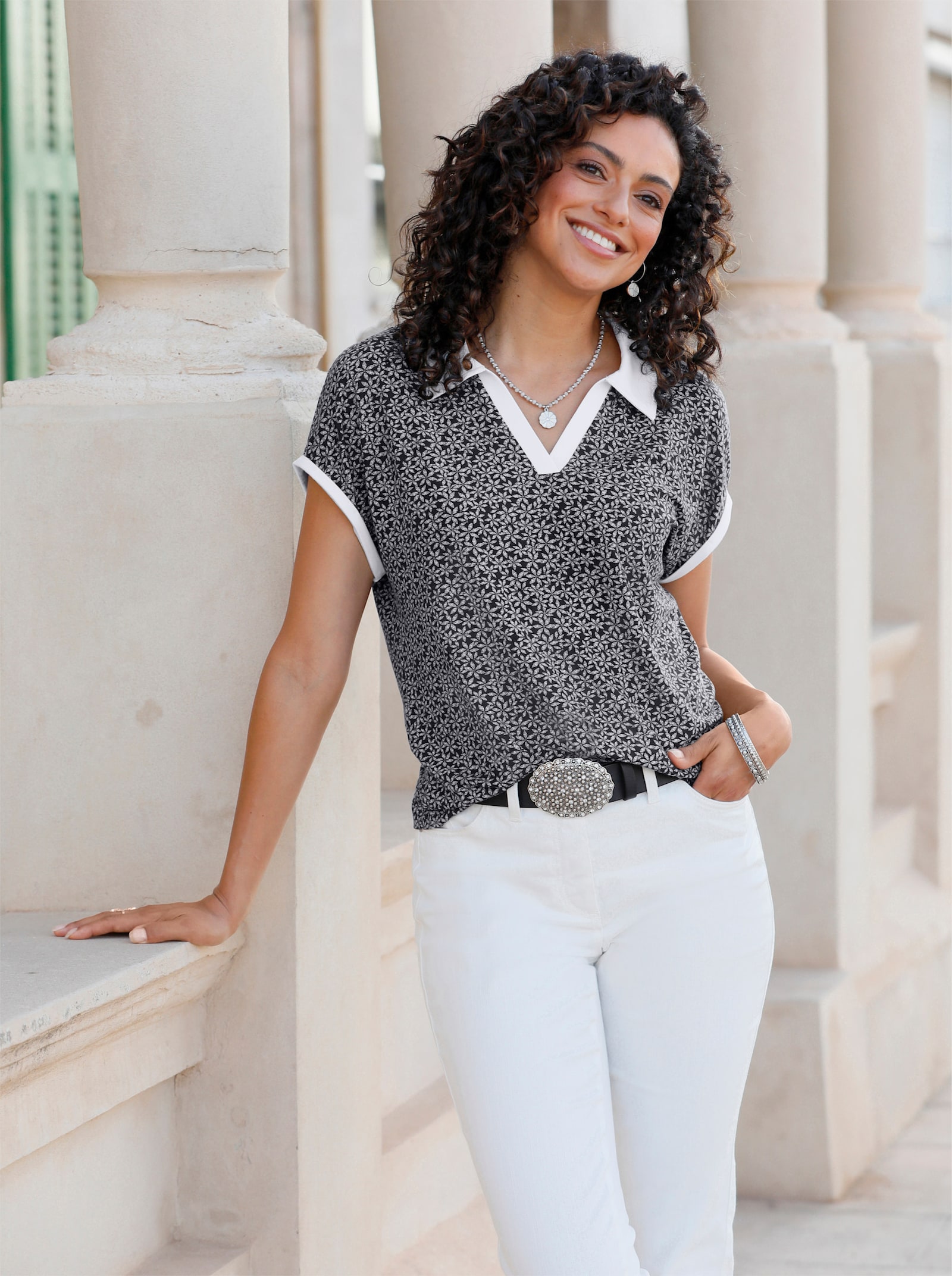 Poloshirt met bloemenprint - zwart/wit geprint