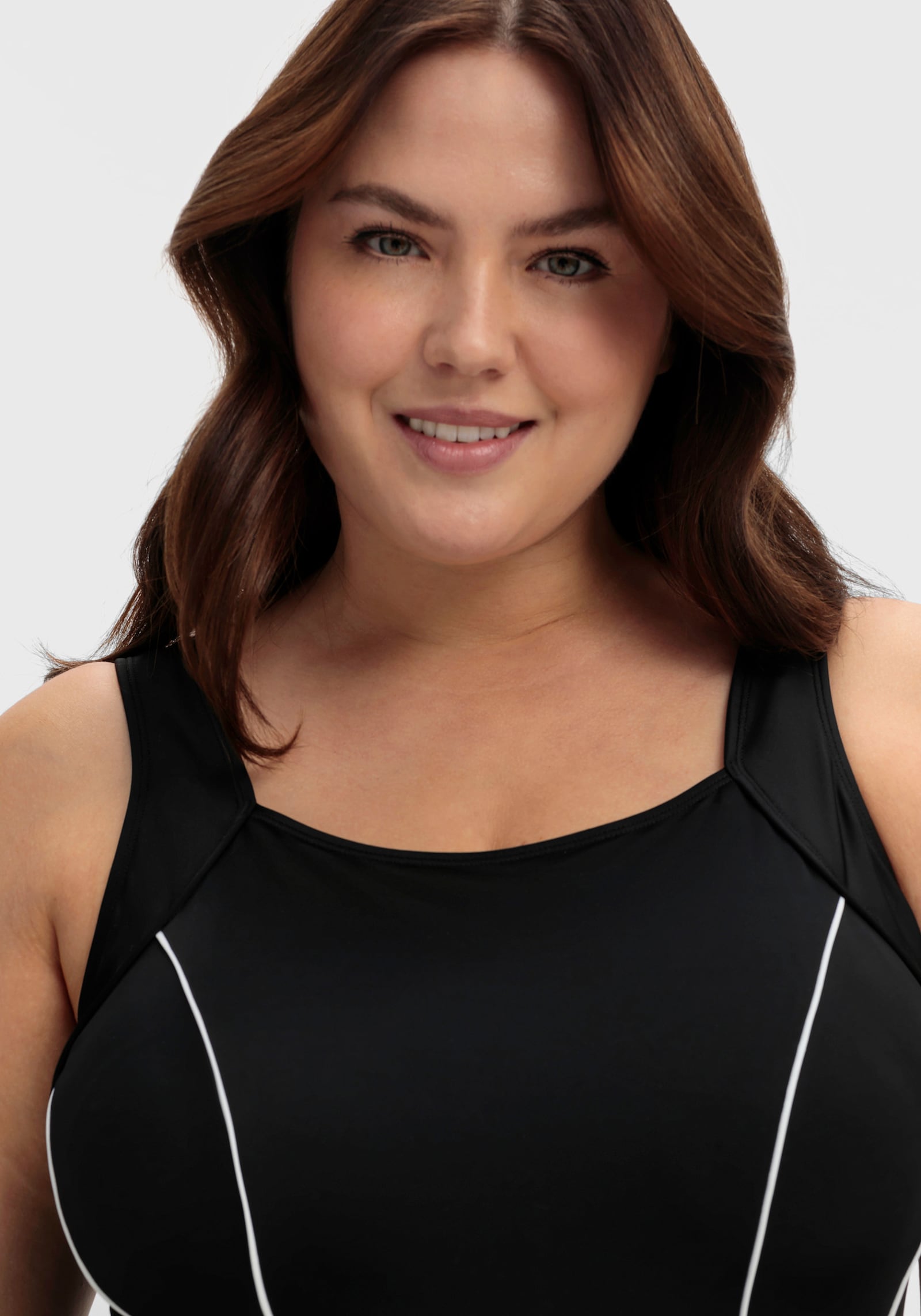 sheego Badeanzug mit Shaping-Effekt - schwarz-weiß