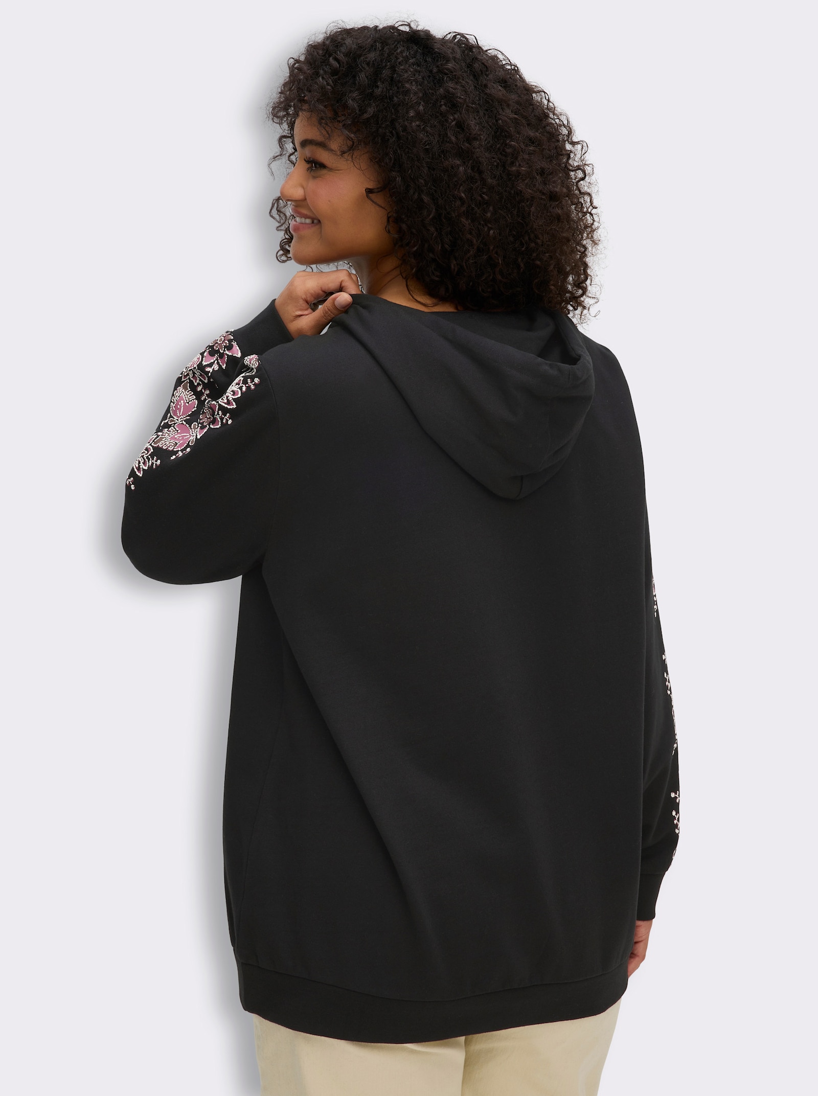 sheego Kapuzensweatshirt mit Blumenprint - schwarz-malve-bedruckt