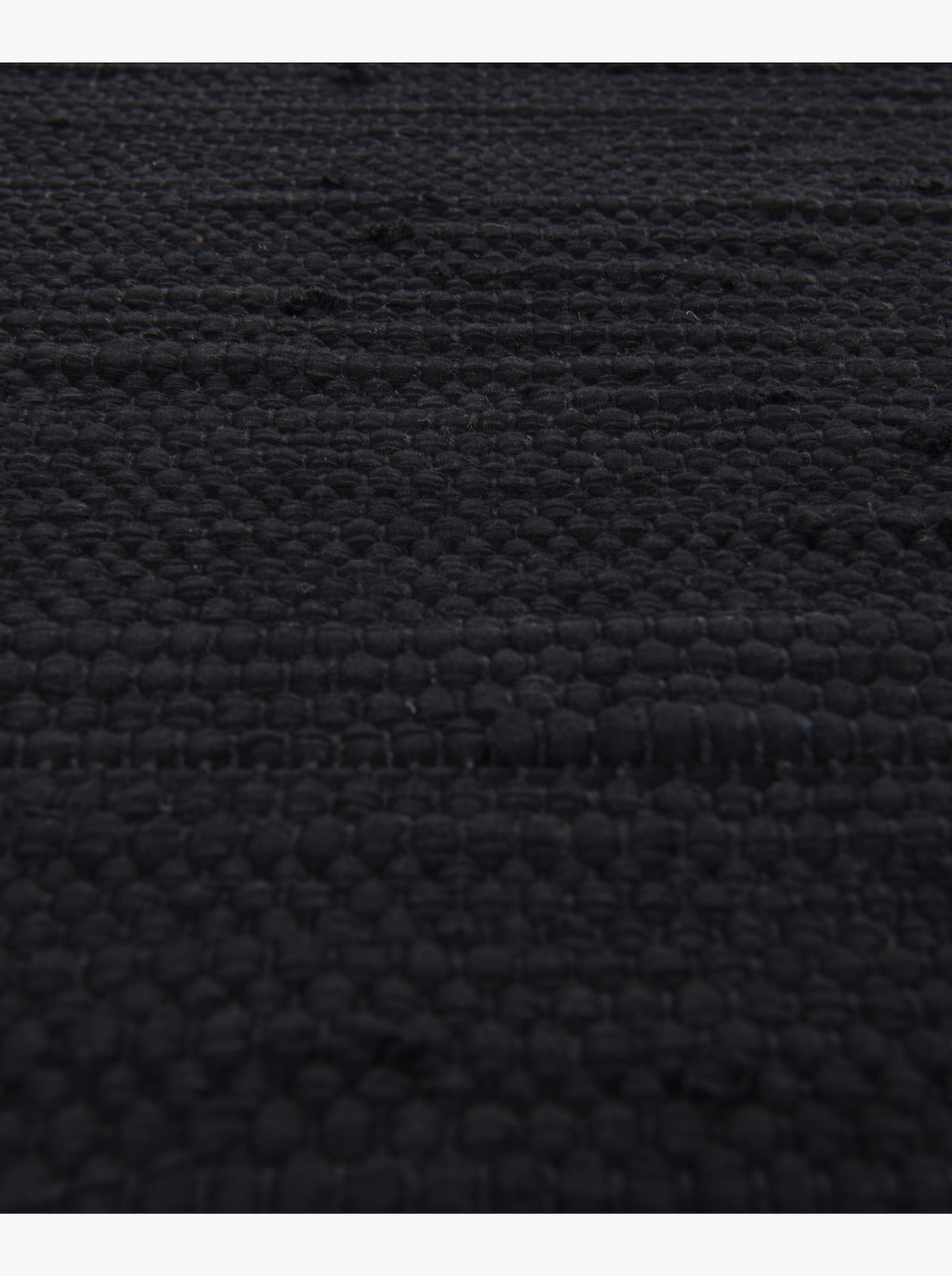 Theko Handwebteppich - schwarz