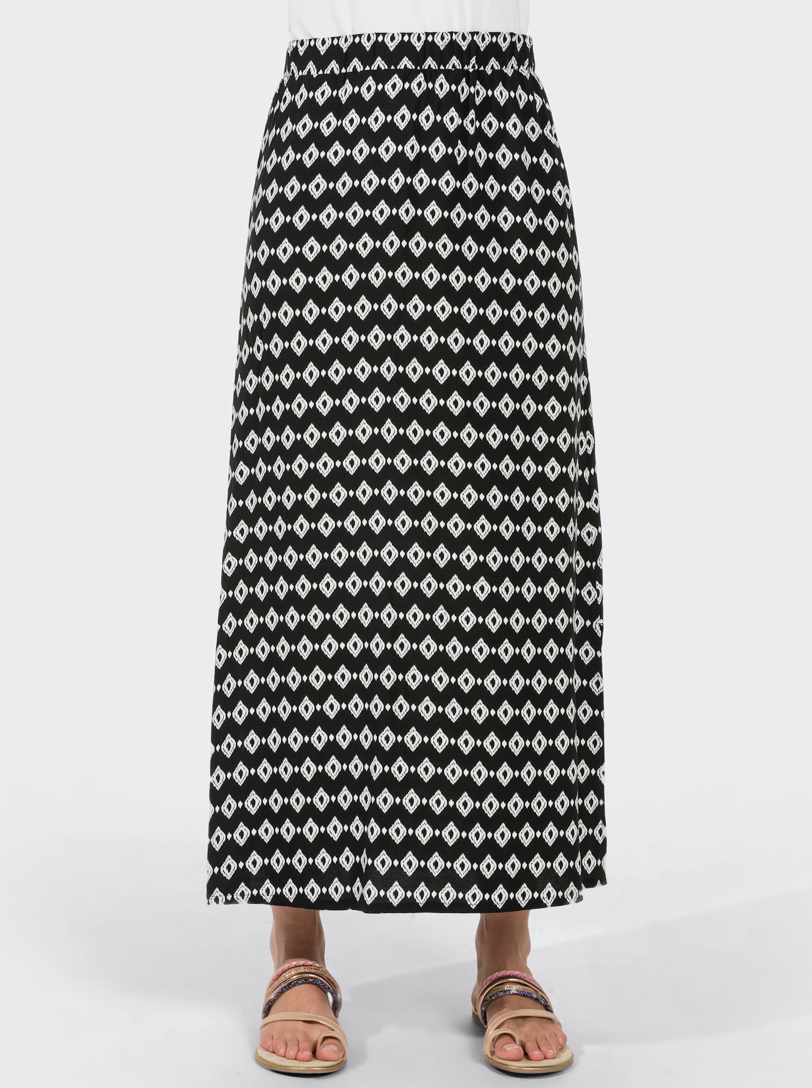 Schlupfrock mit langen Seitenschlitzen - schwarz-gemustert