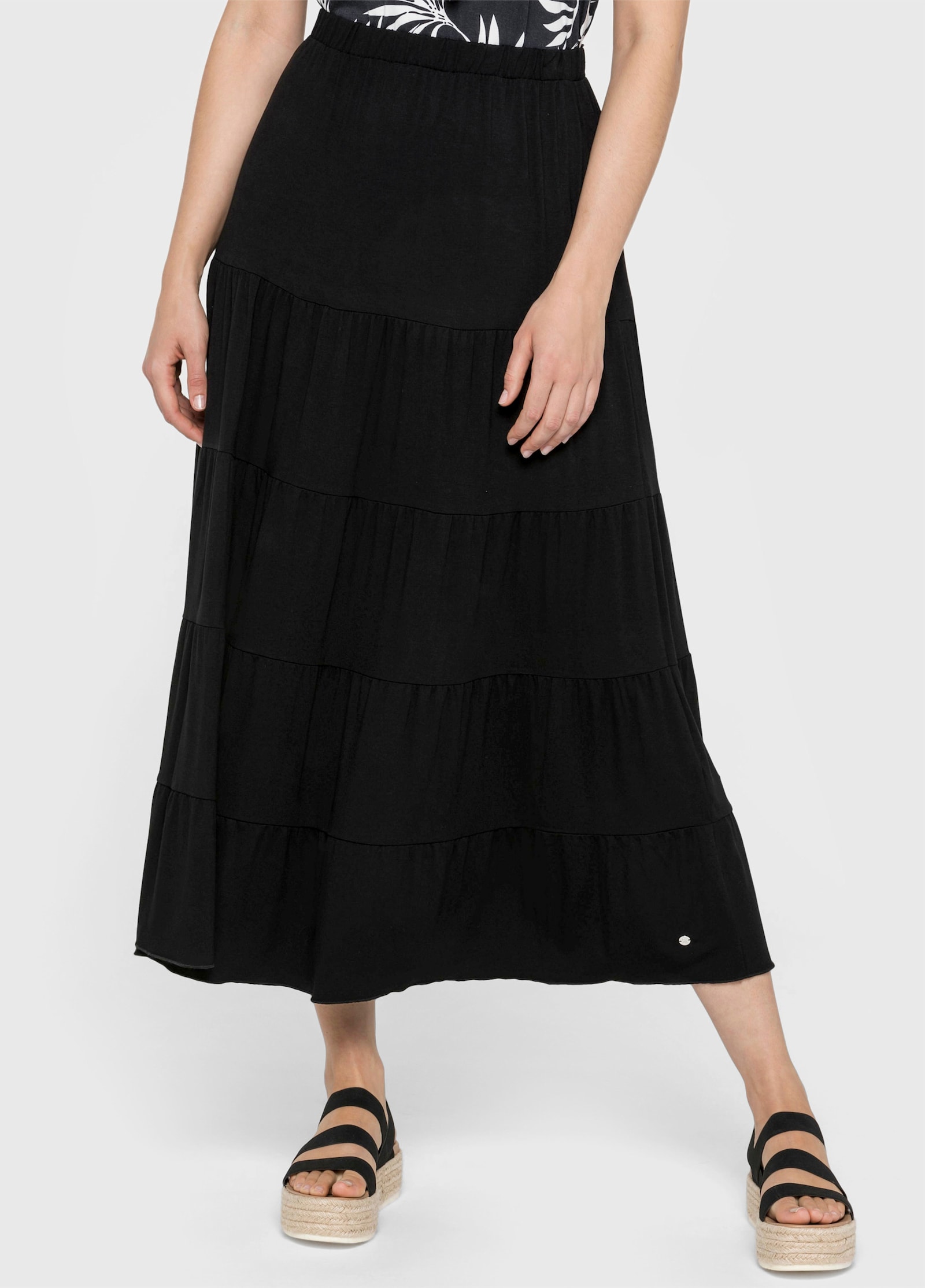 sheego Jerseyrock mit stufigen Volants - schwarz