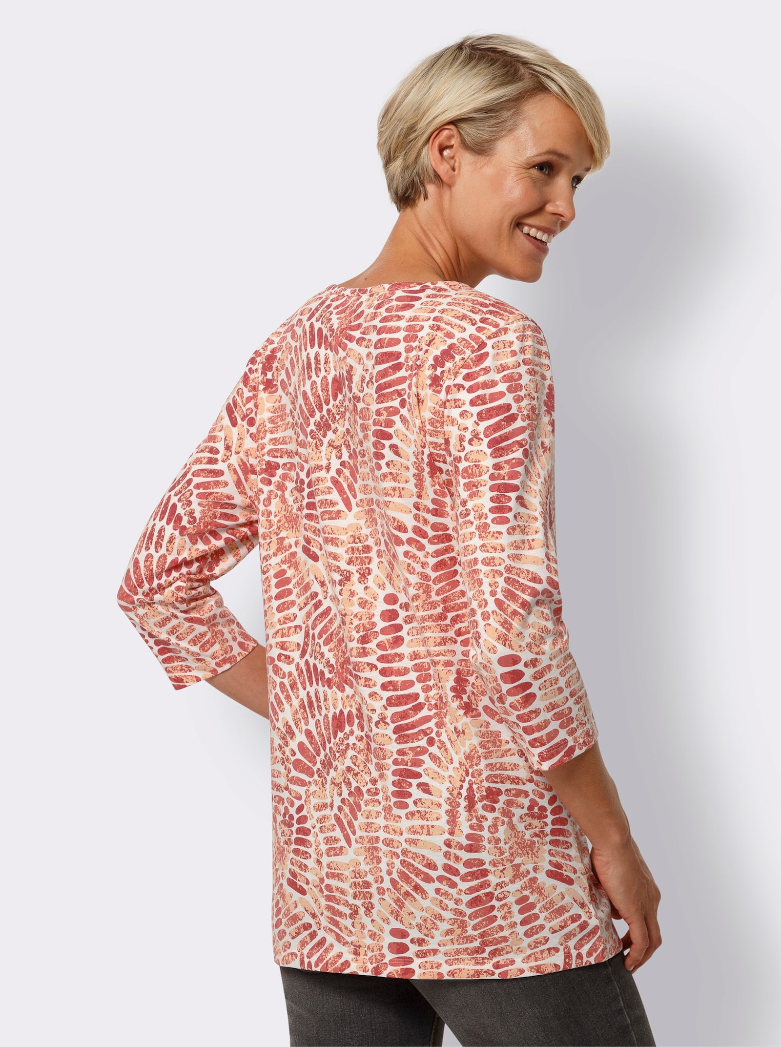 Lång topp med motveck fram - ecru-aprikos, med tryck