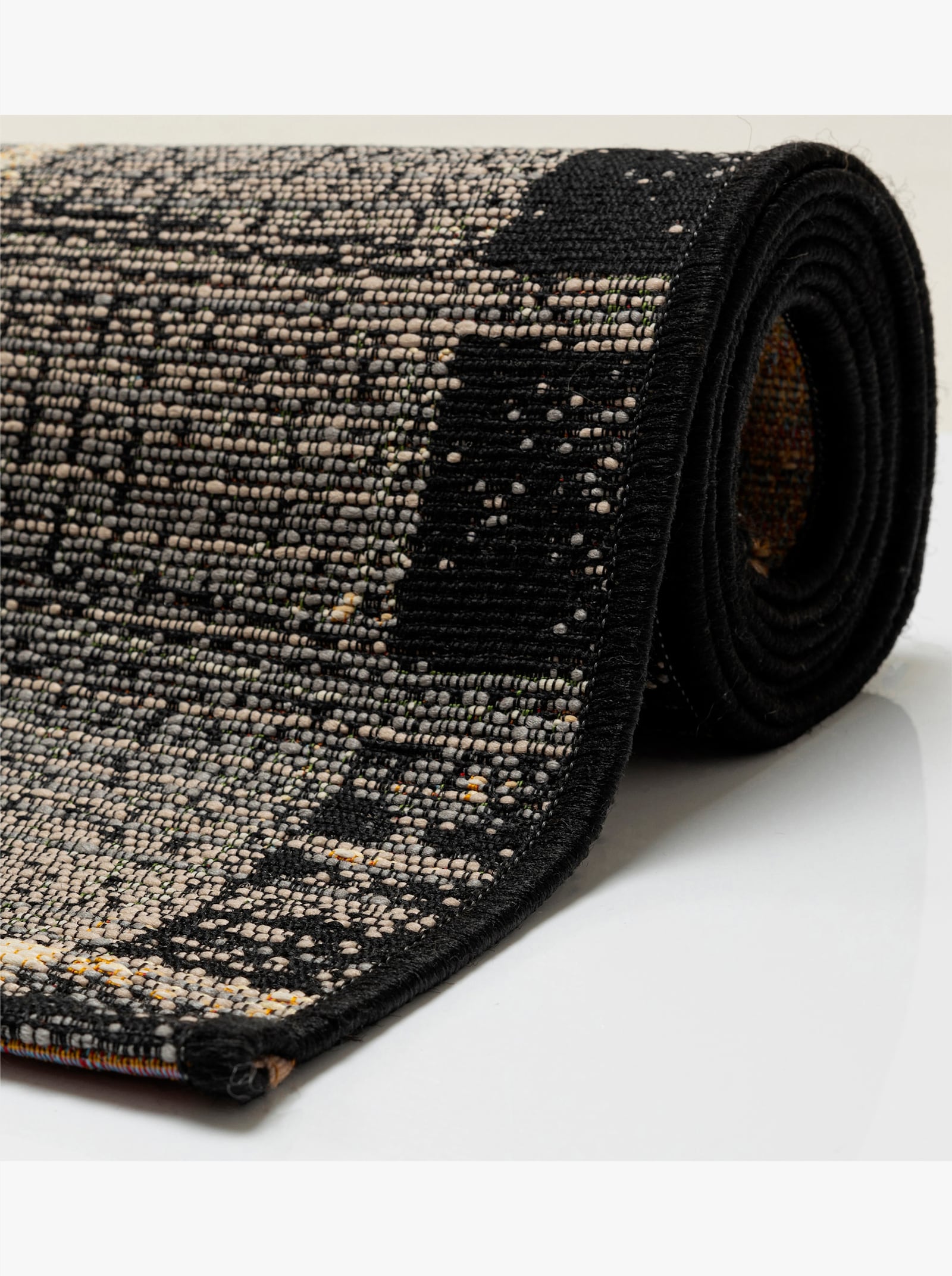 Theko Teppich - grau