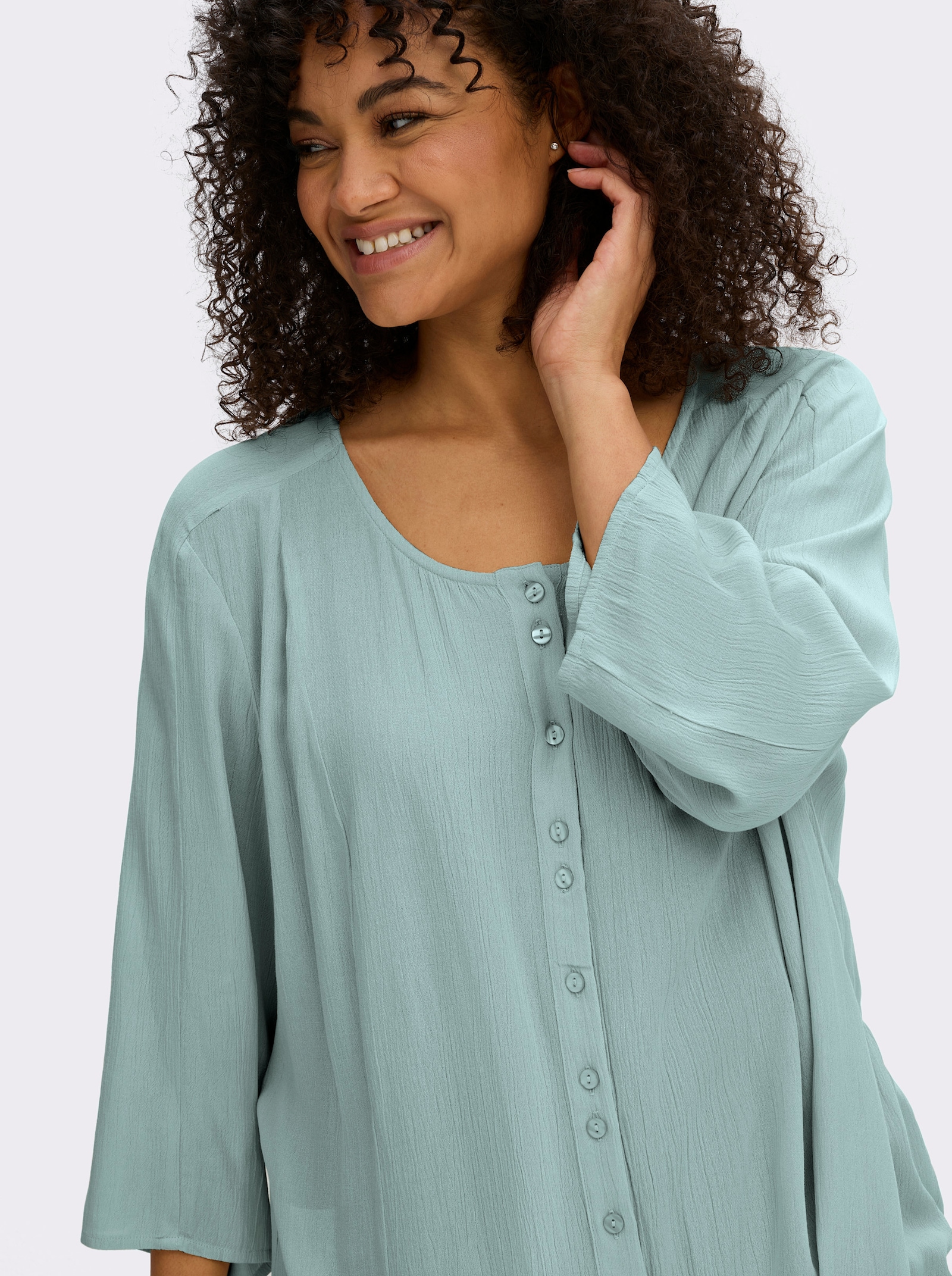 sheego Crinklebluse mit Volant am Saum - kalkmint