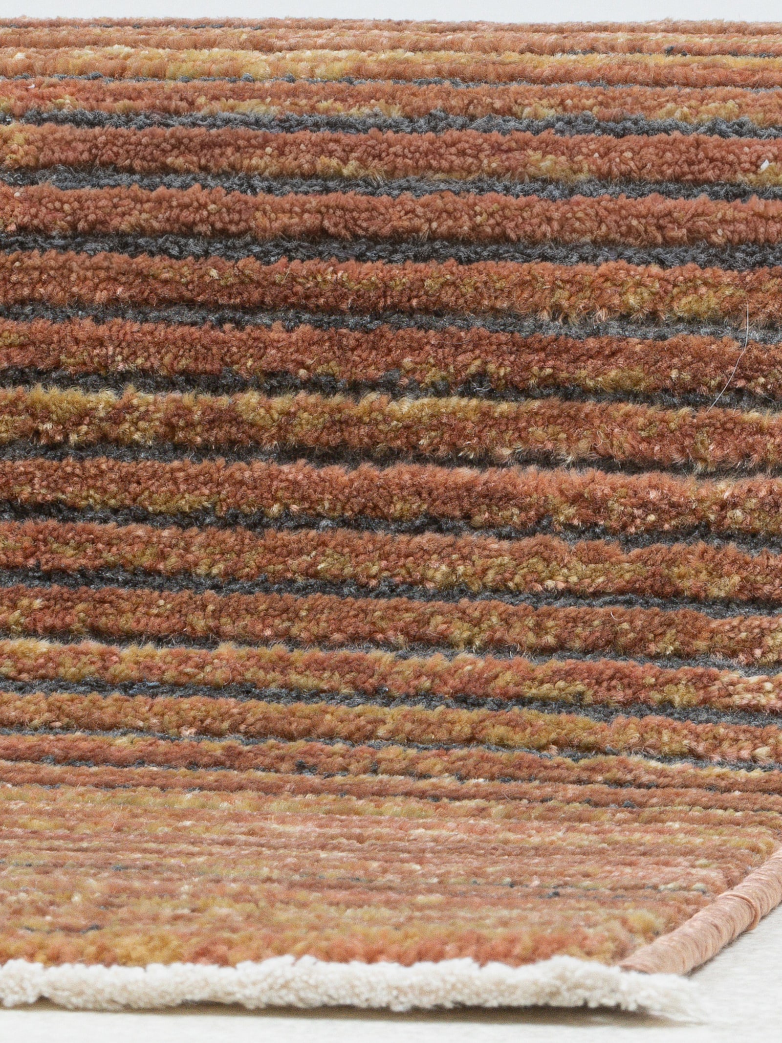 Theko Teppich - rost-meliert