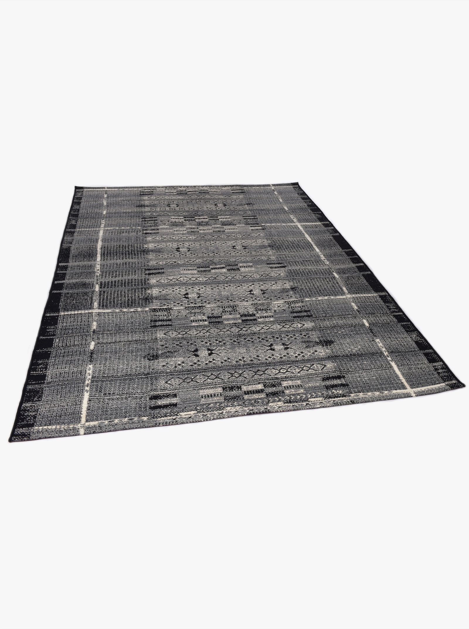 Theko Teppich - grau