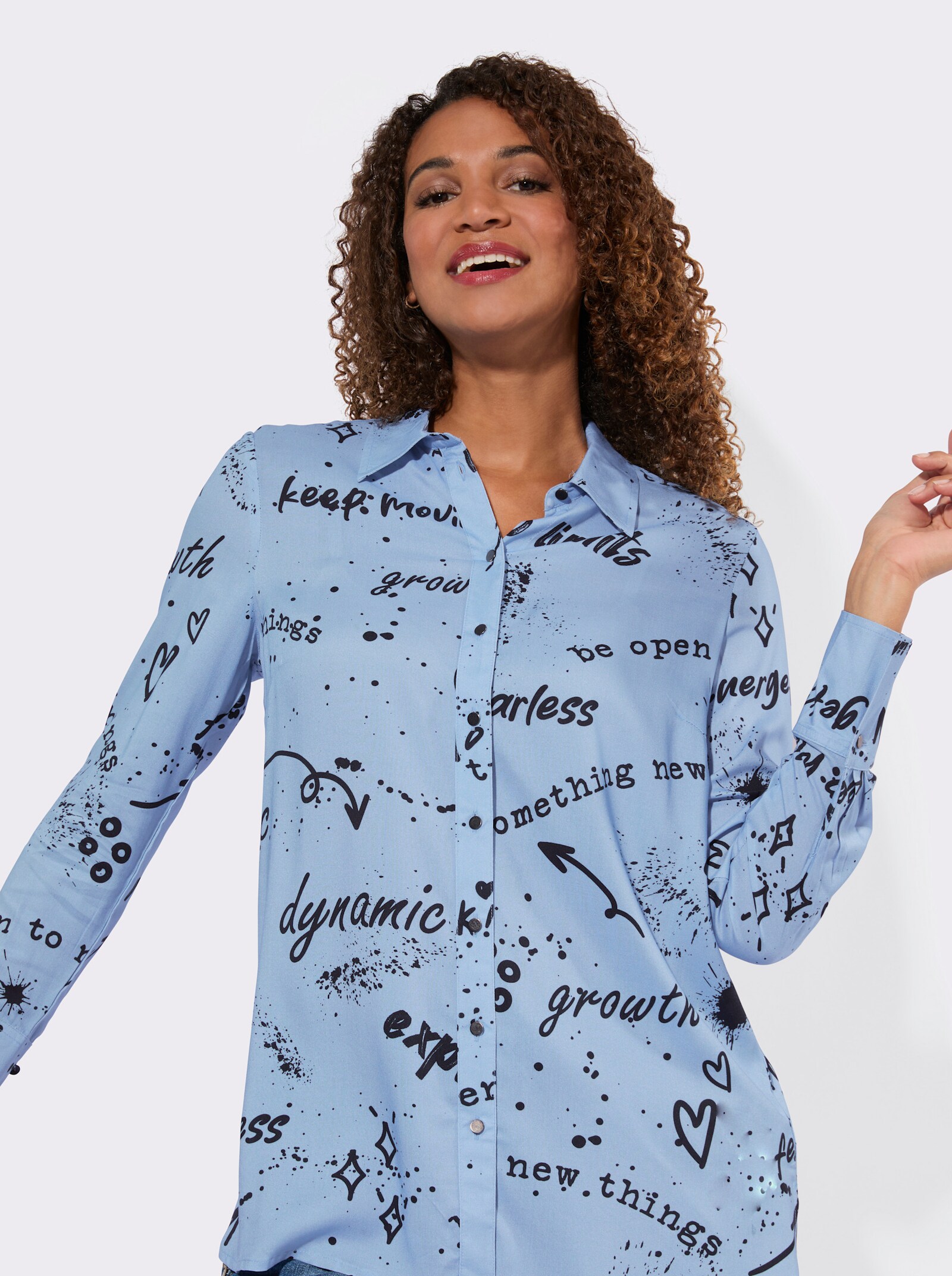 Druckbluse mit abgerundeten Seitenschlitzen - himmelblau-schwarz-bedruckt