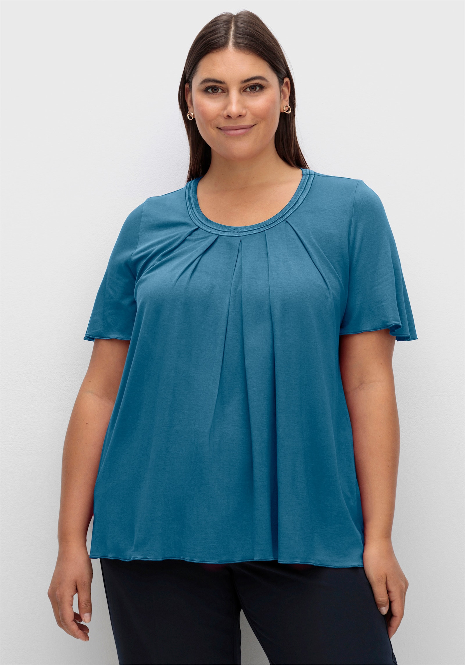 sheego Shirt mit Kellerfalte vorn - topas
