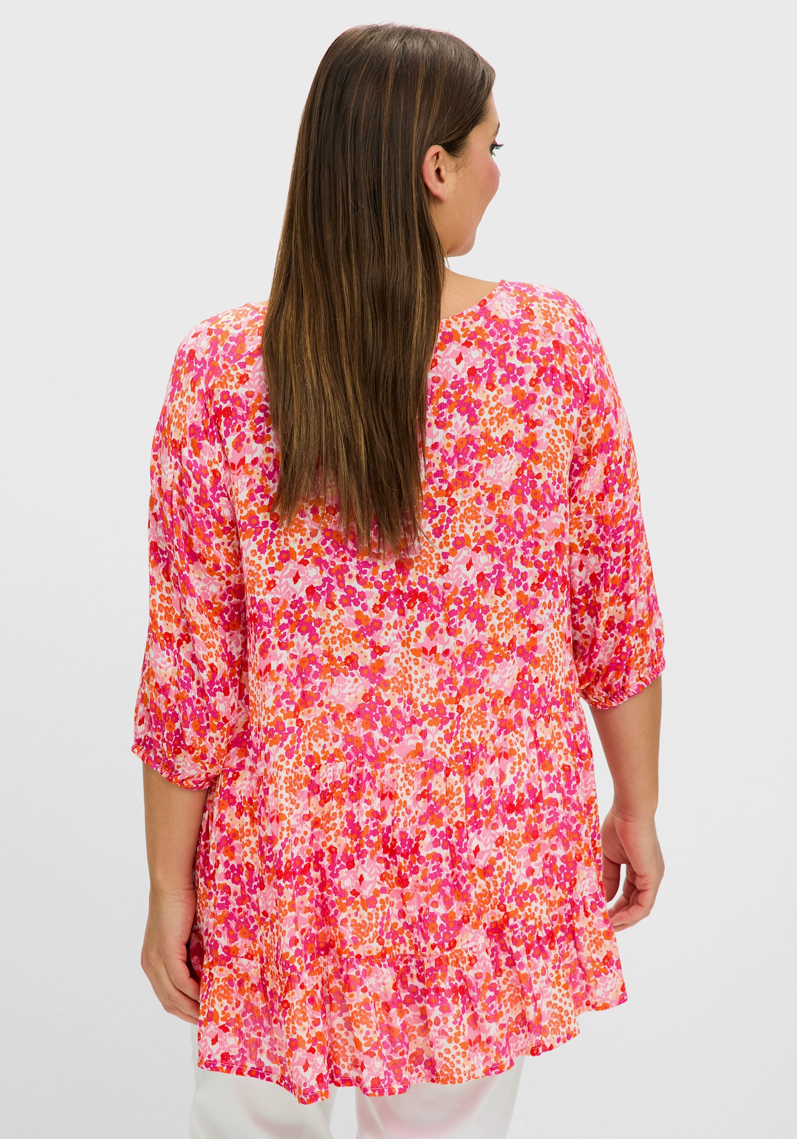 sheego Druckbluse in Crêpe-Qualität, mit Volant am Saum - pink gemustert