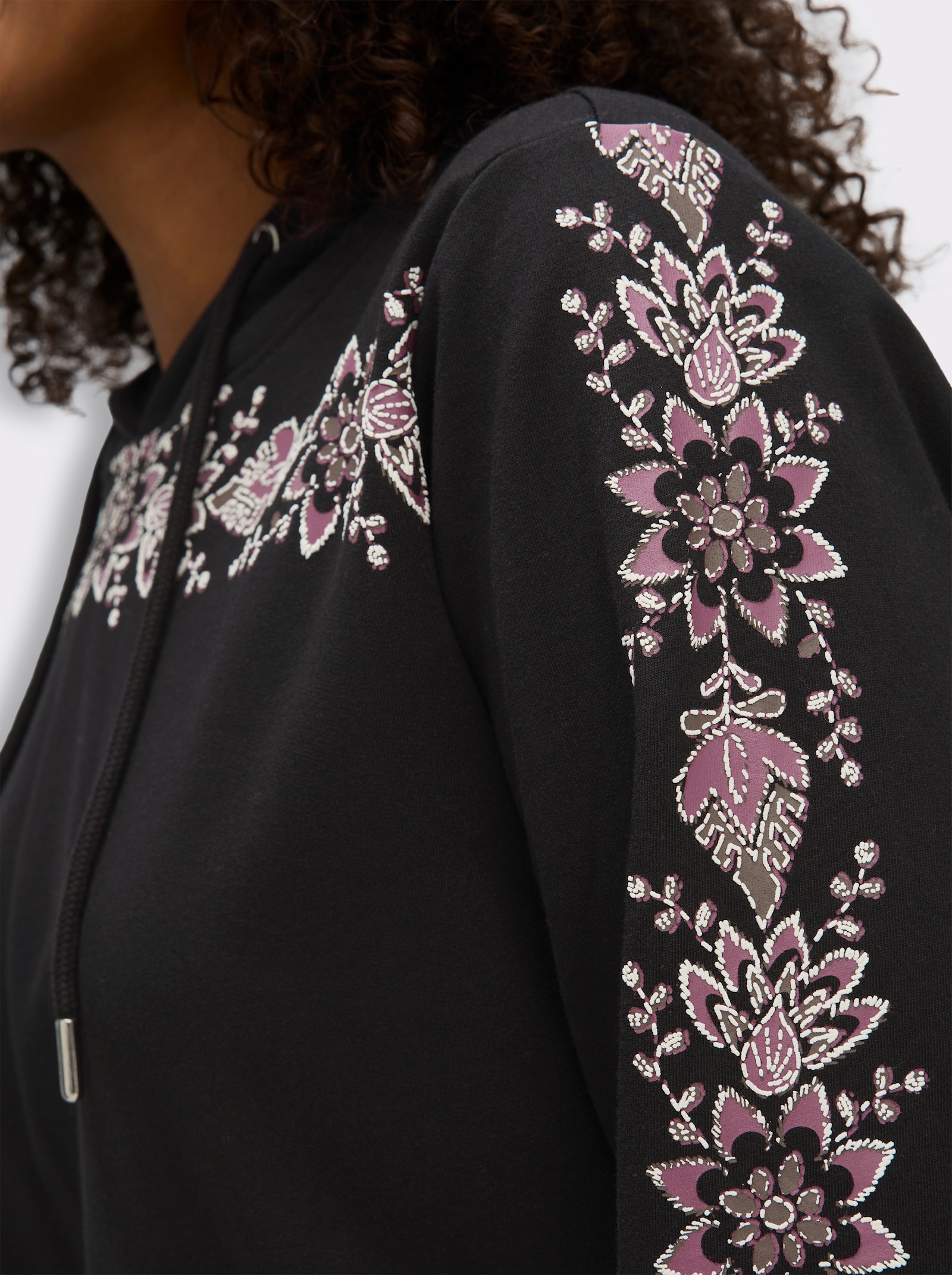 sheego Kapuzensweatshirt mit Blumenprint - schwarz-malve-bedruckt
