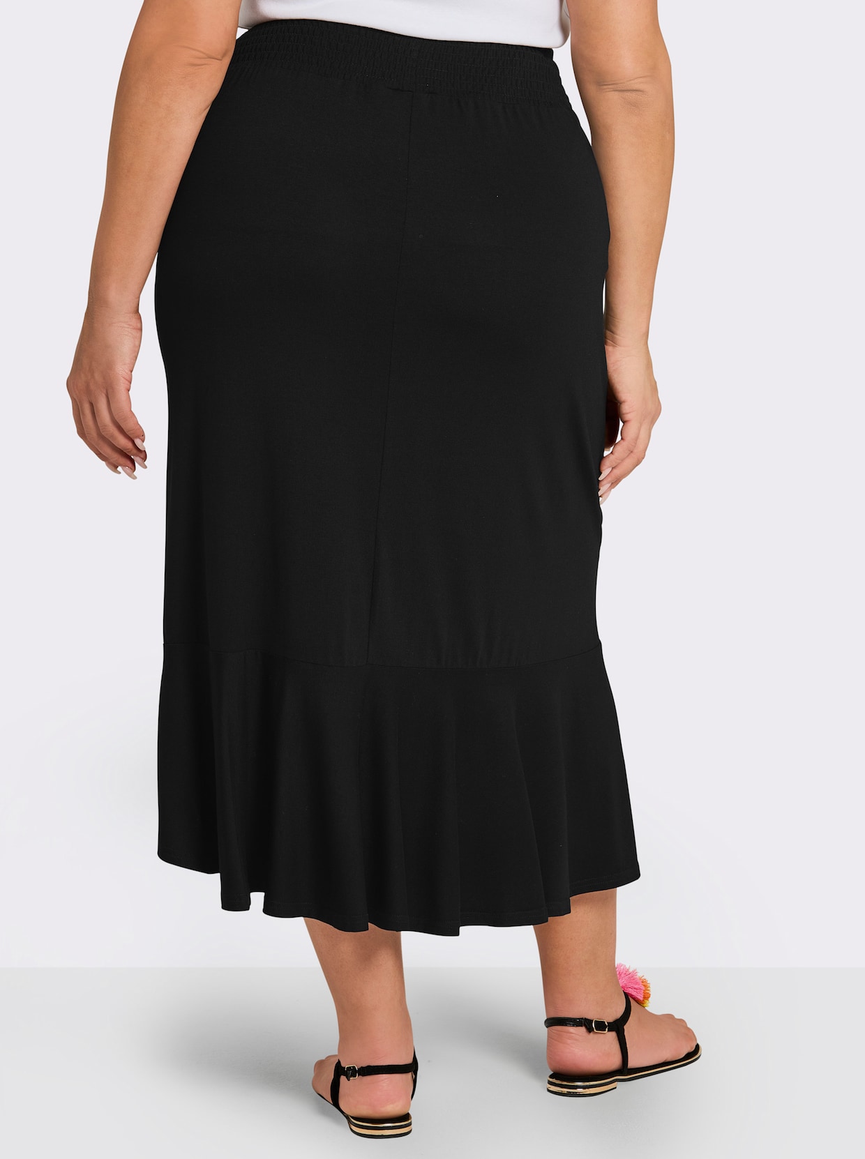 sheego Schlupfrock mit asymmetrischem Saum - schwarz