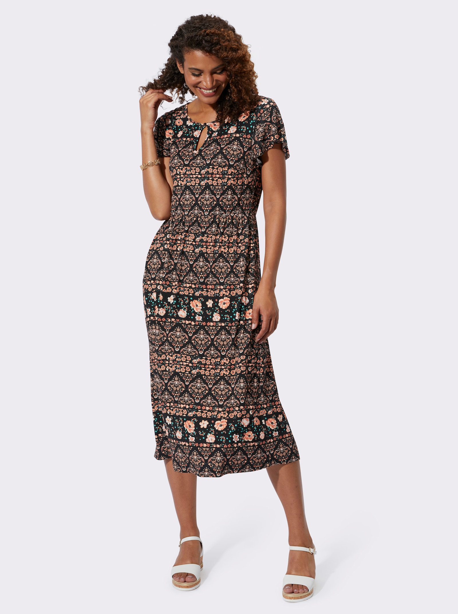 Jerseyjurk met elastiek op taillehoogte - papaja/zwart bedrukt