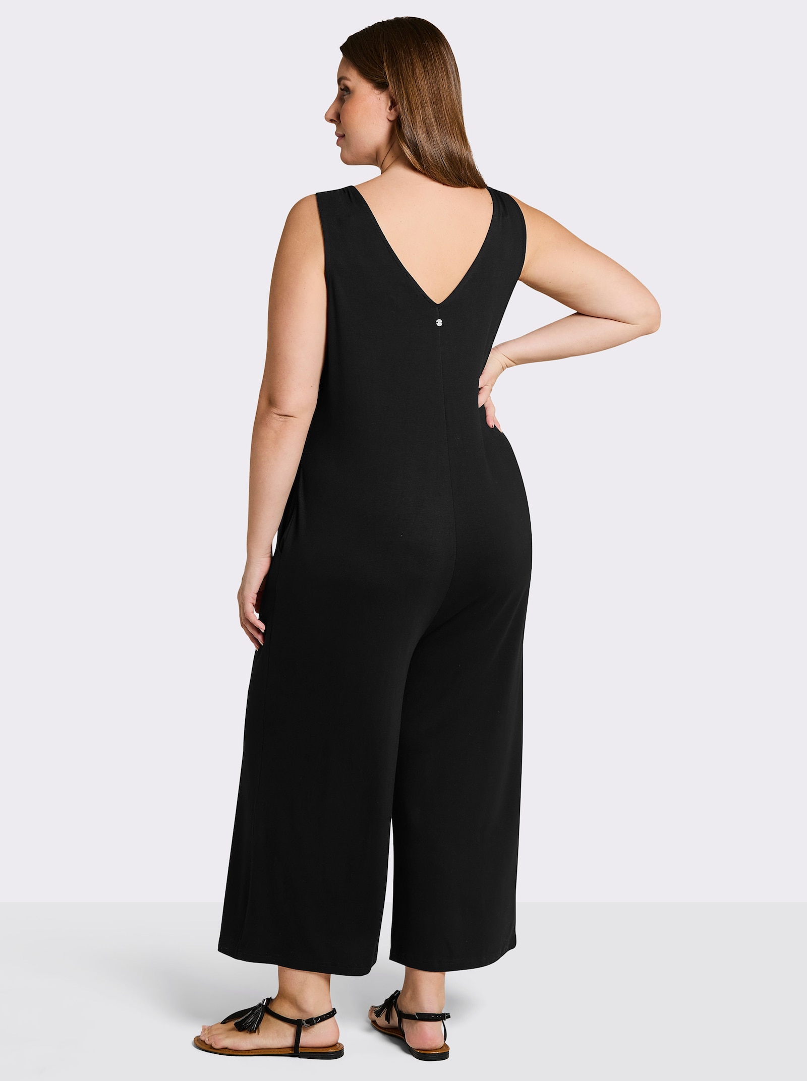 sheego Jumpsuit mit kurzer Knopfleiste - schwarz