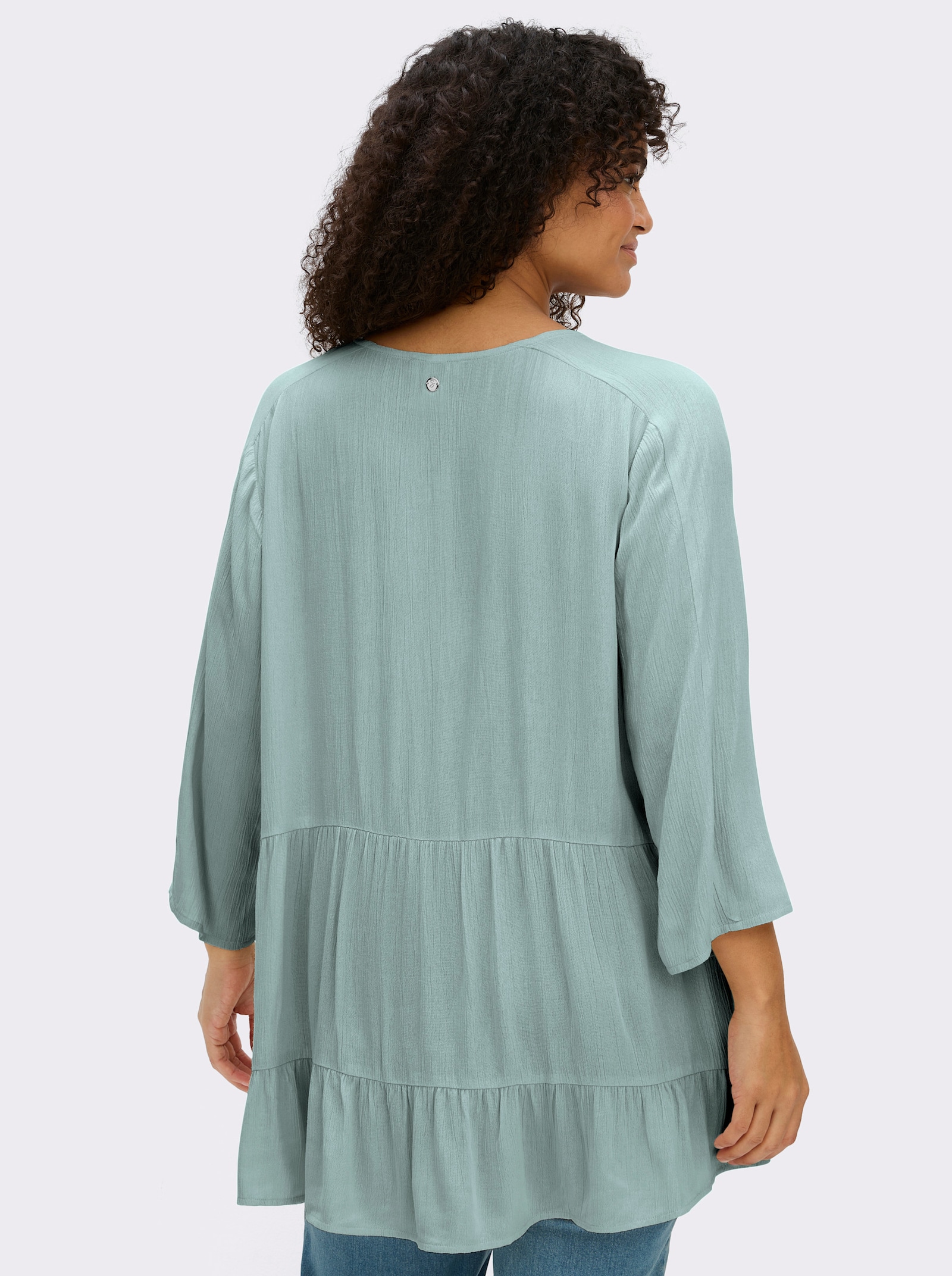 sheego Crinklebluse mit Volant am Saum - kalkmint