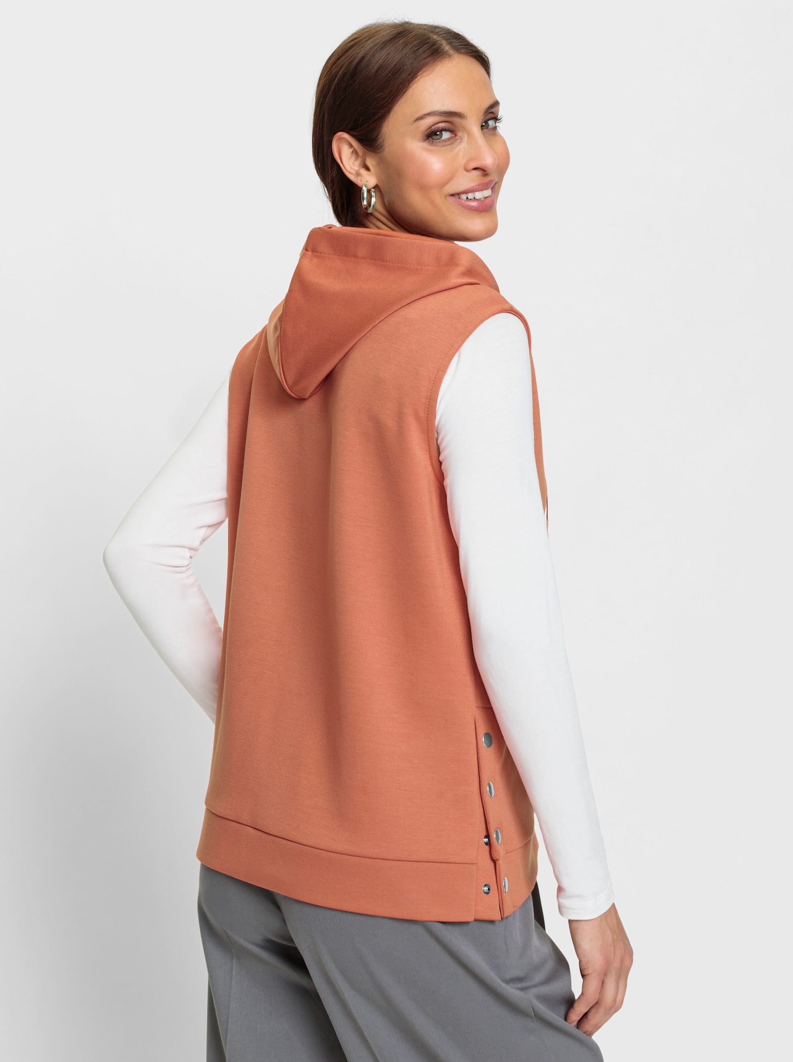 Sweatvest met drukknopen in de zijsplitten - papaya