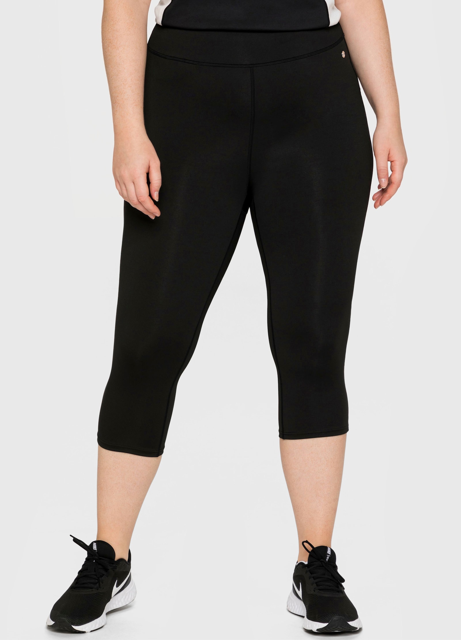 sheego Functionele tight in caprilengte - zwart