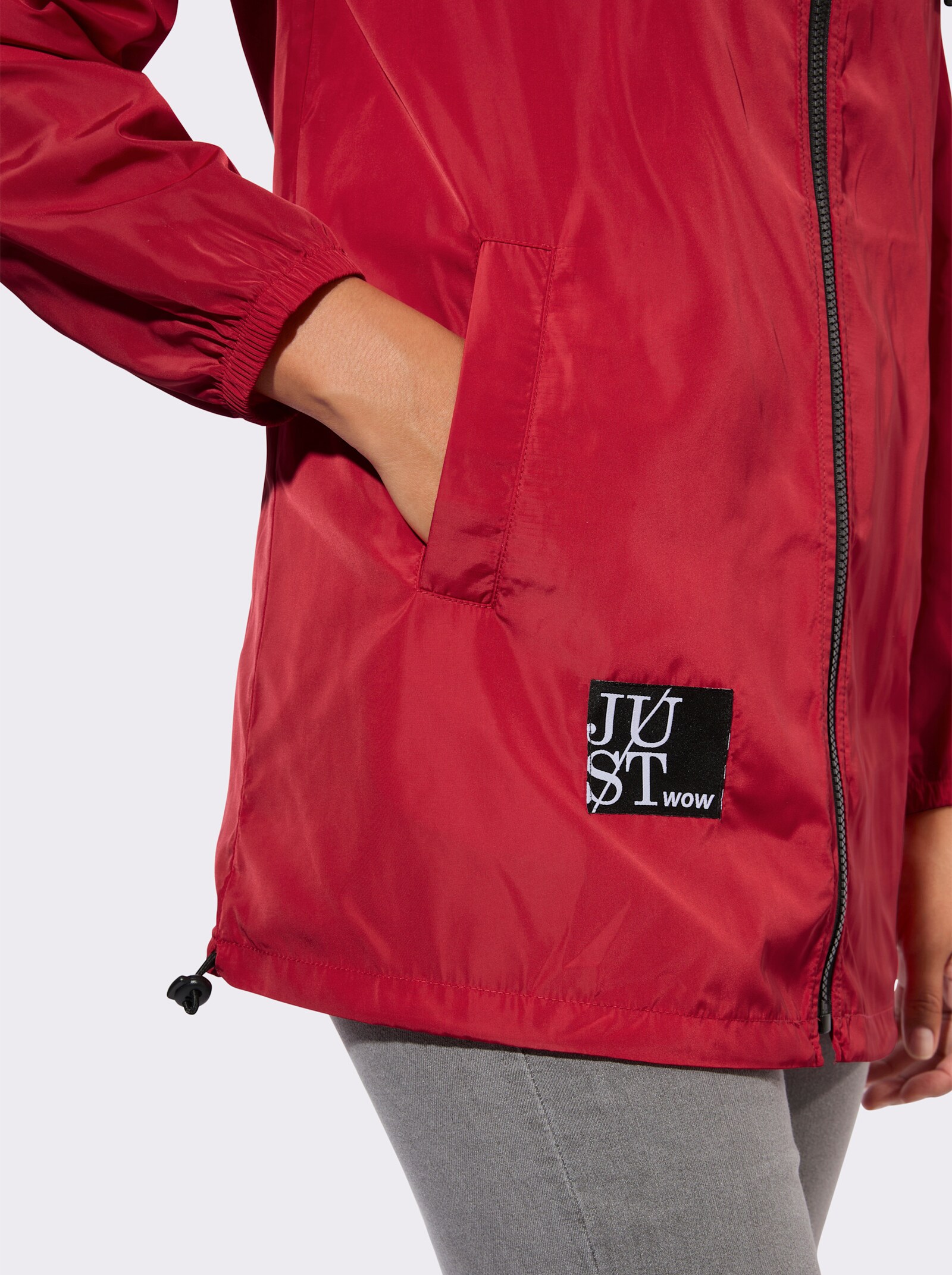 Kapuzenjacke mit Schriftzug im Comic-Stil - rot