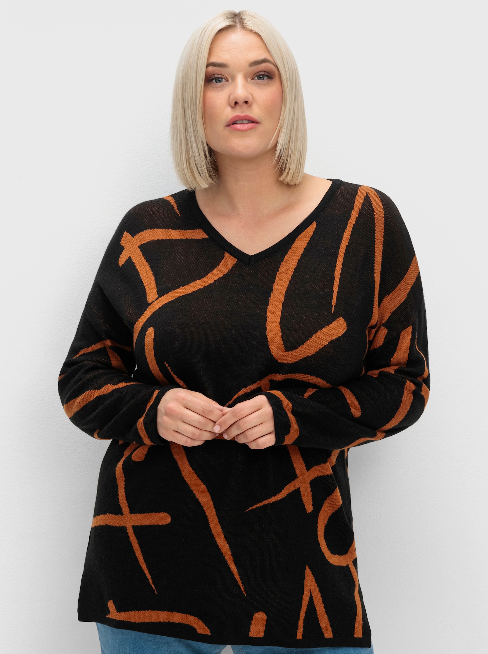 Longpullover mit Seitenschlitzen - schwarz-cognac-gemustert