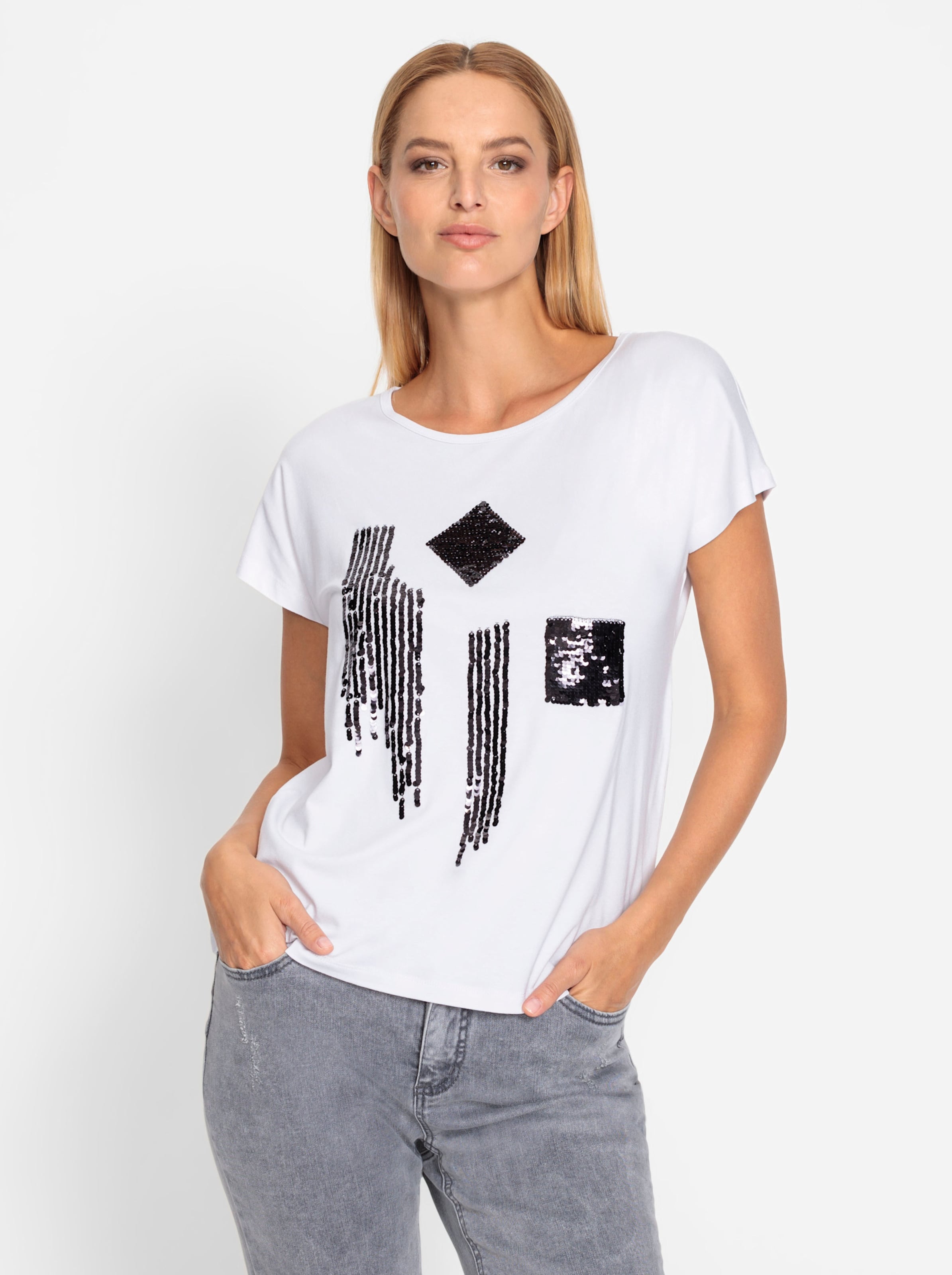 SSIG günstig Kaufen-Shirt in weiß-schwarz-gemustert von heine. Shirt in weiß-schwarz-gemustert von heine <![CDATA[Shirt Auffallend schön durch trendige Pailletten-Verzierung vorne. Mit Rundhalsausschnitt und lässig überschnittenem Kurzarm.]]>. 