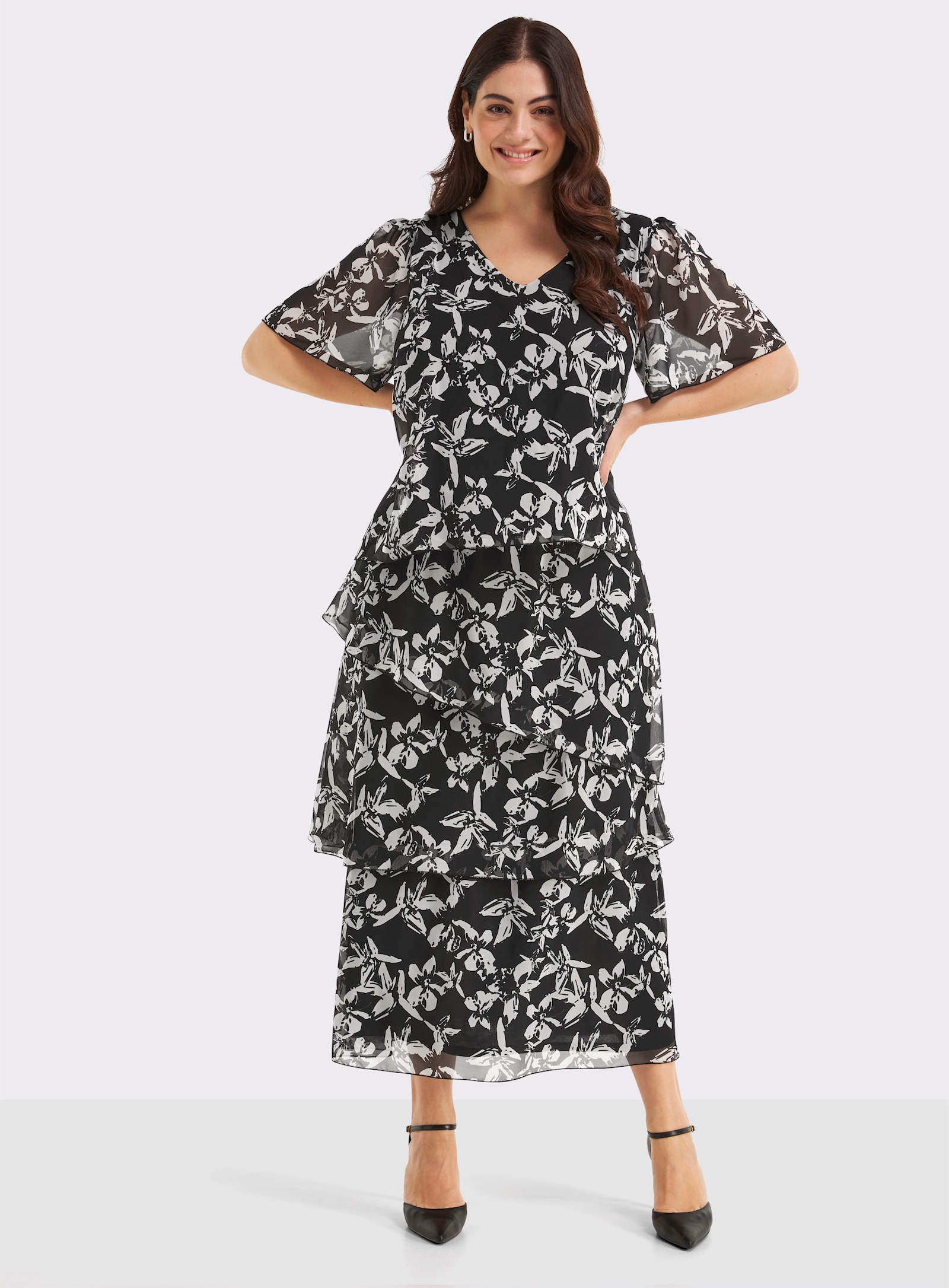 sheego Chiffonkleid mit drapierten Volants - schwarz-weiß-gemustert