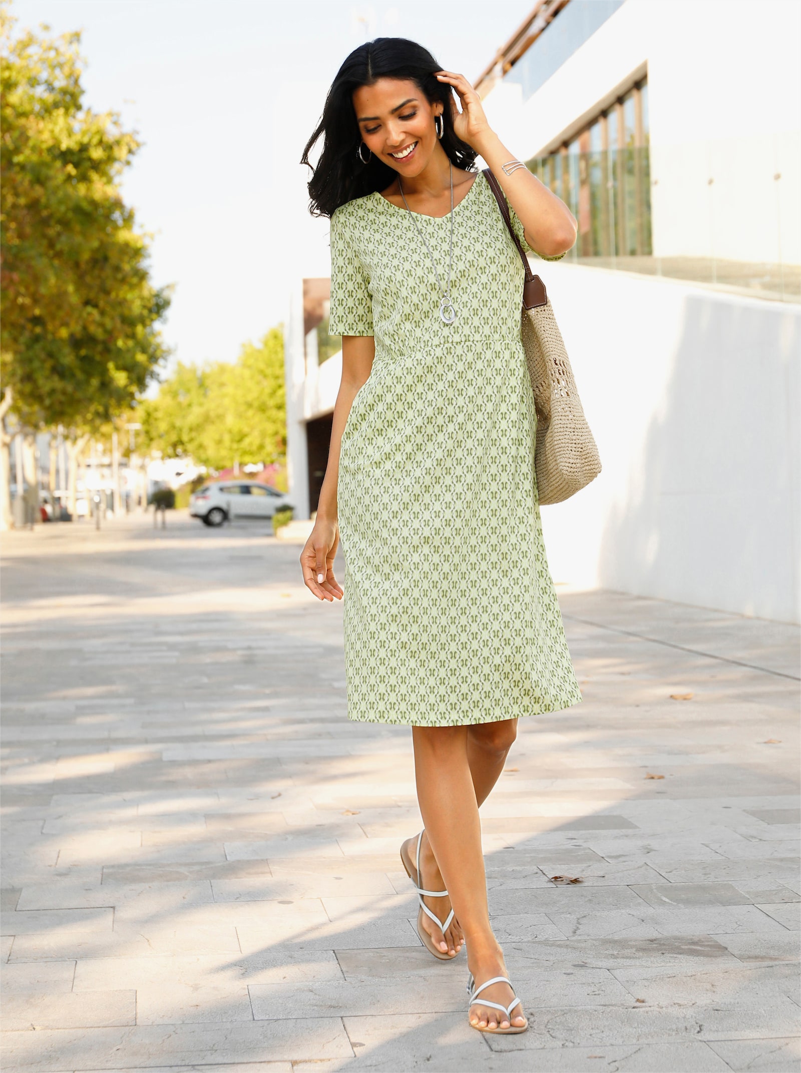 Jerseyjurk met zakken - pistache/kaki bedrukt